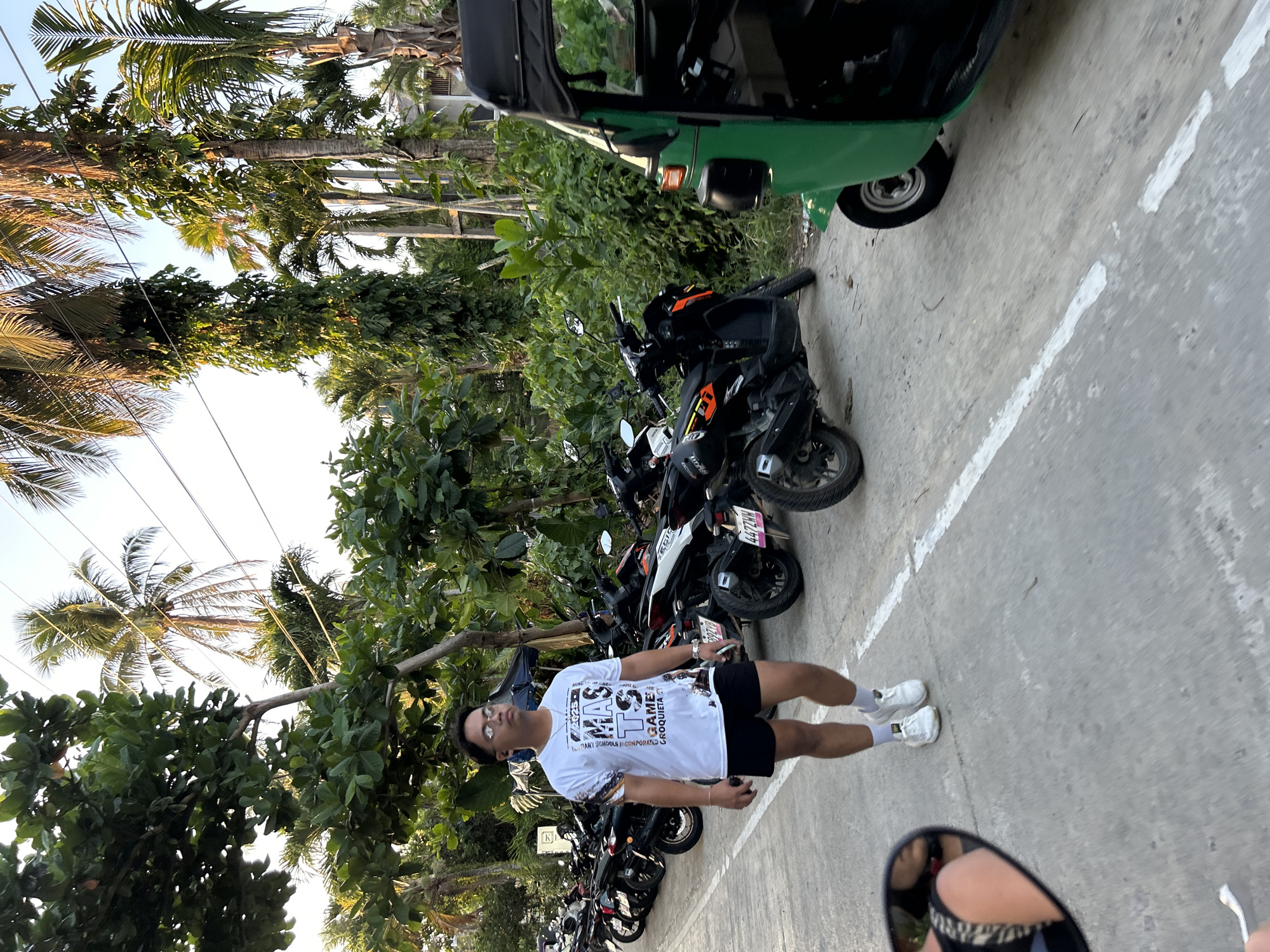 Daily life scene captured near motorcycles and store in General Luna