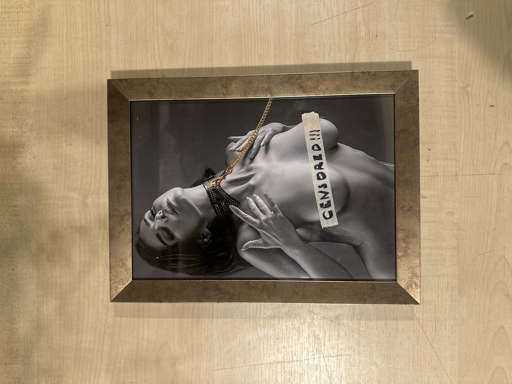 Two framed photographs on display in Lapės, Lithuania