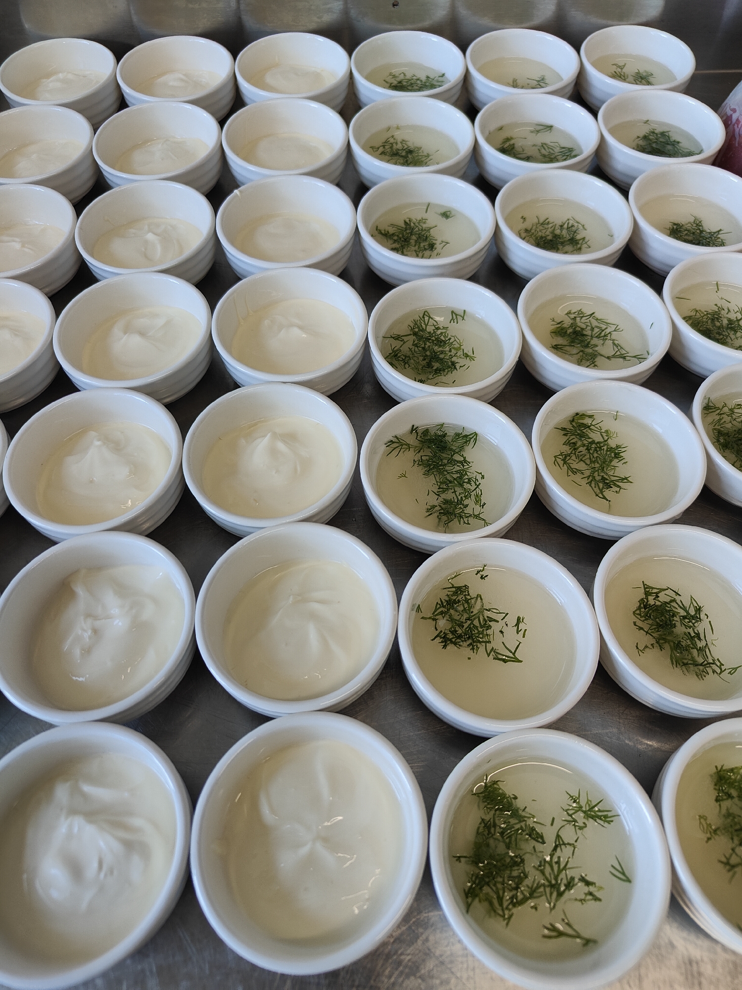 Fruit platters and portioned bowls ready in an Aktau kitchen
