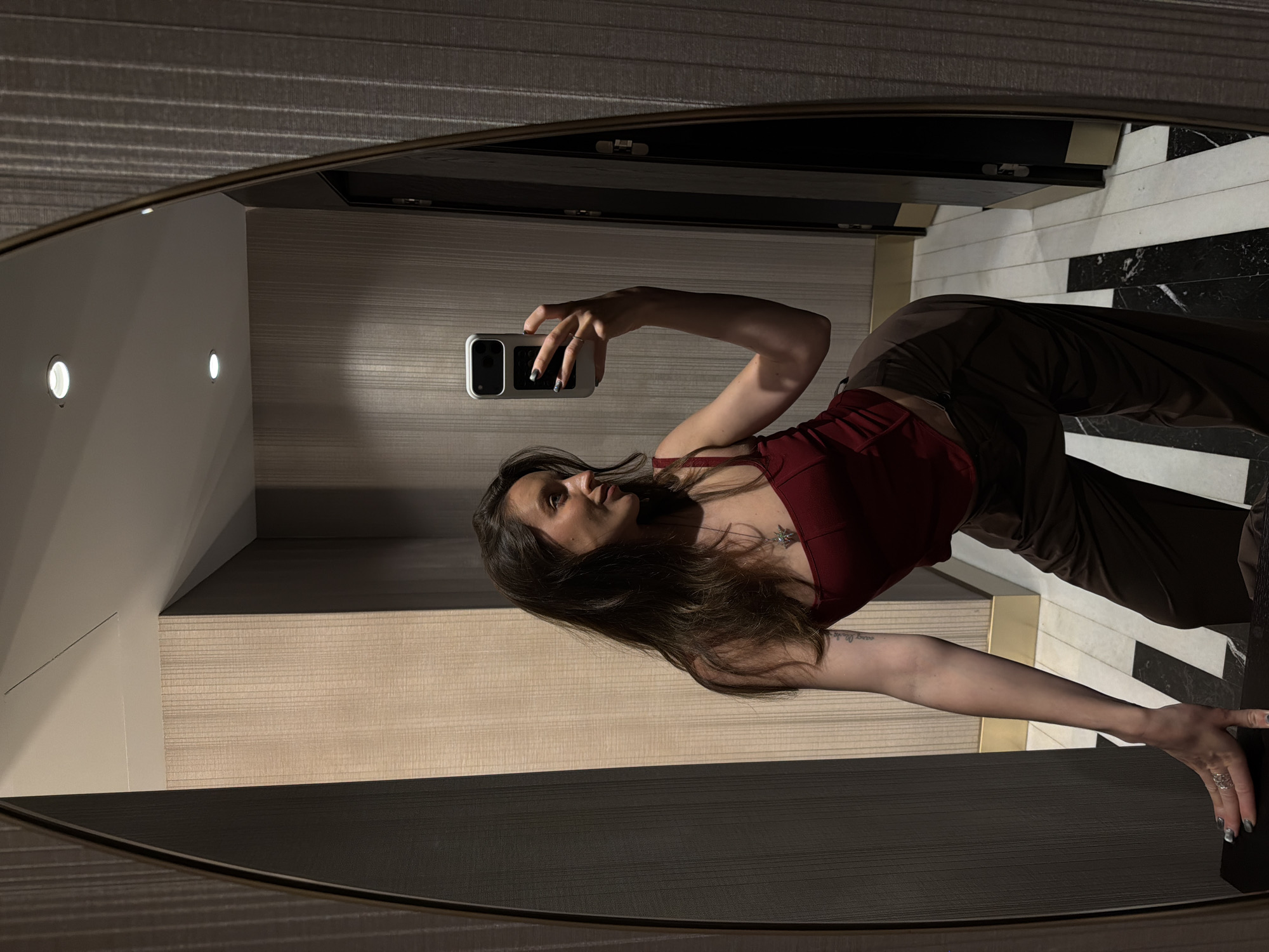 Woman takes mirror selfies in Budva hotel room