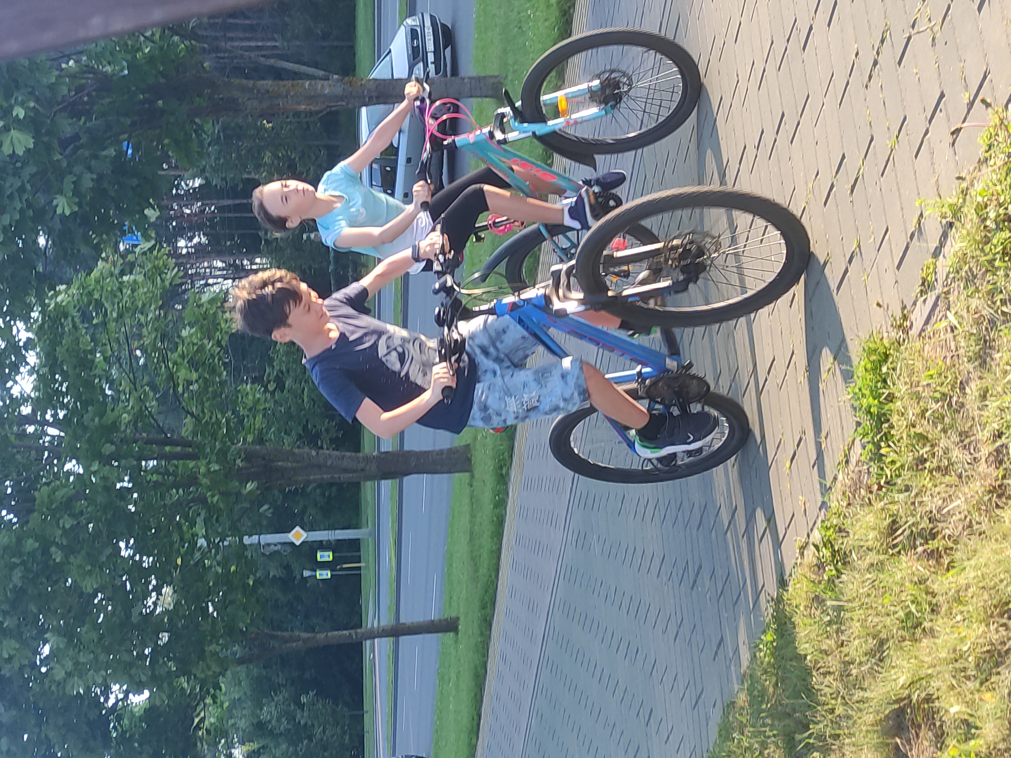 Kids cycling along a paved path in Mahilyow