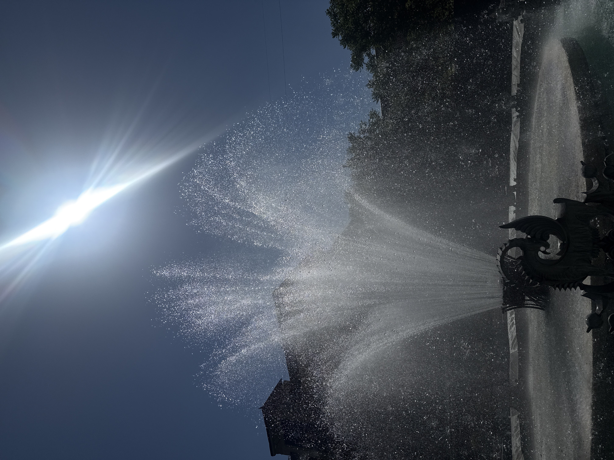 Fountain operates at Yerevan's Charles Aznavour Square on sunny morning