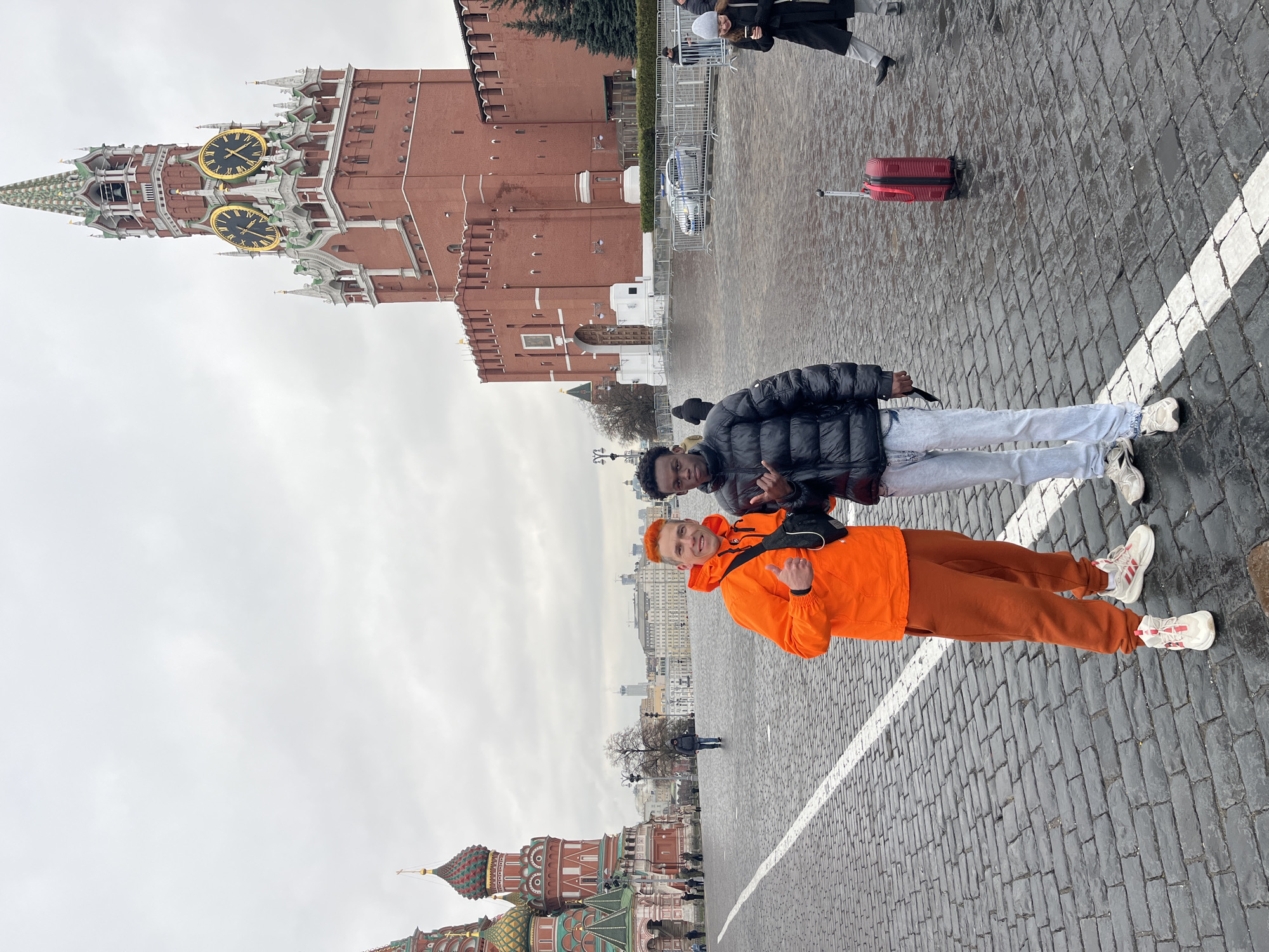 Young men pose on Moscow pedestrian crossing