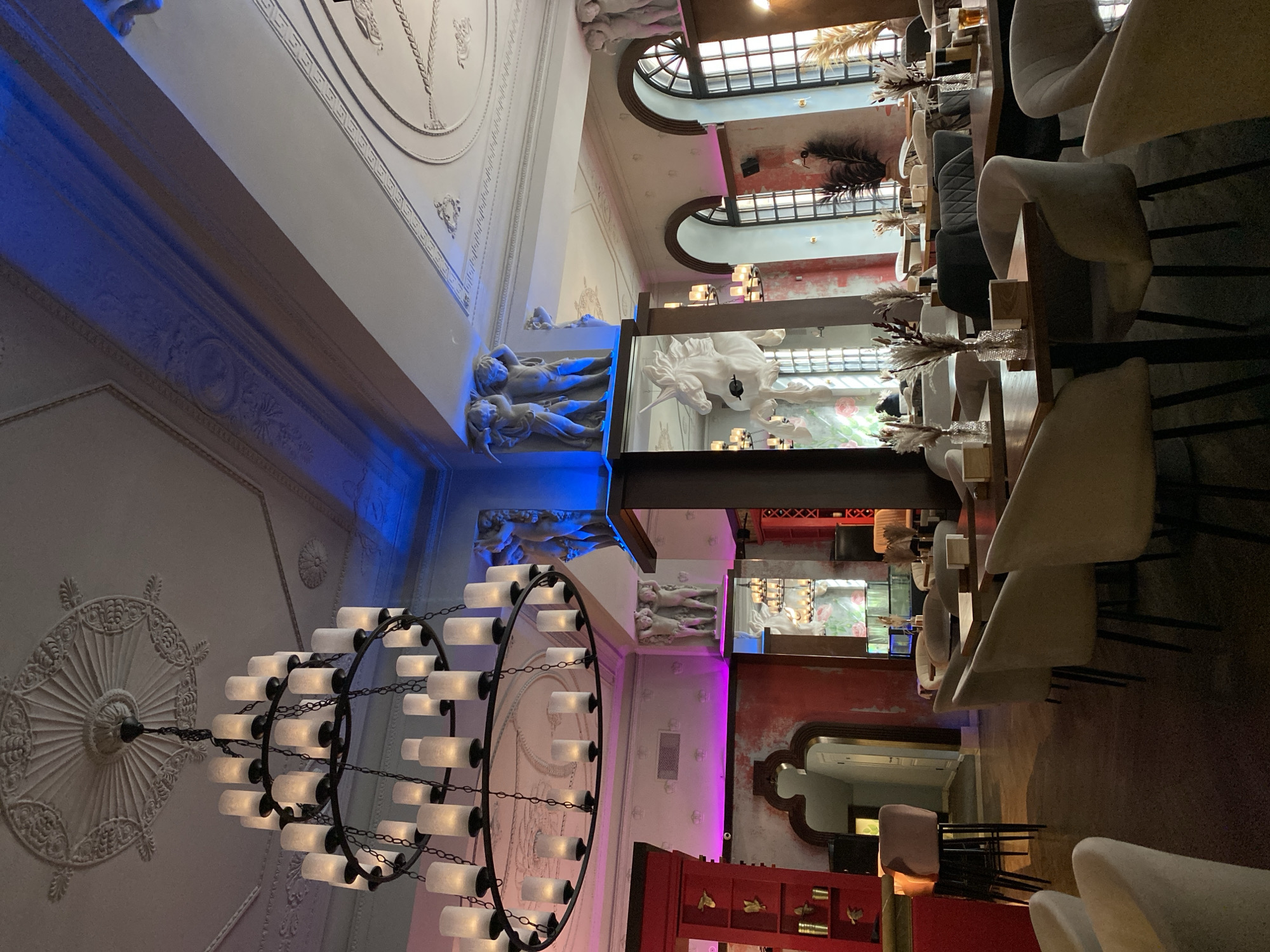 Ornate restaurant interior with classical architecture documented by witness
