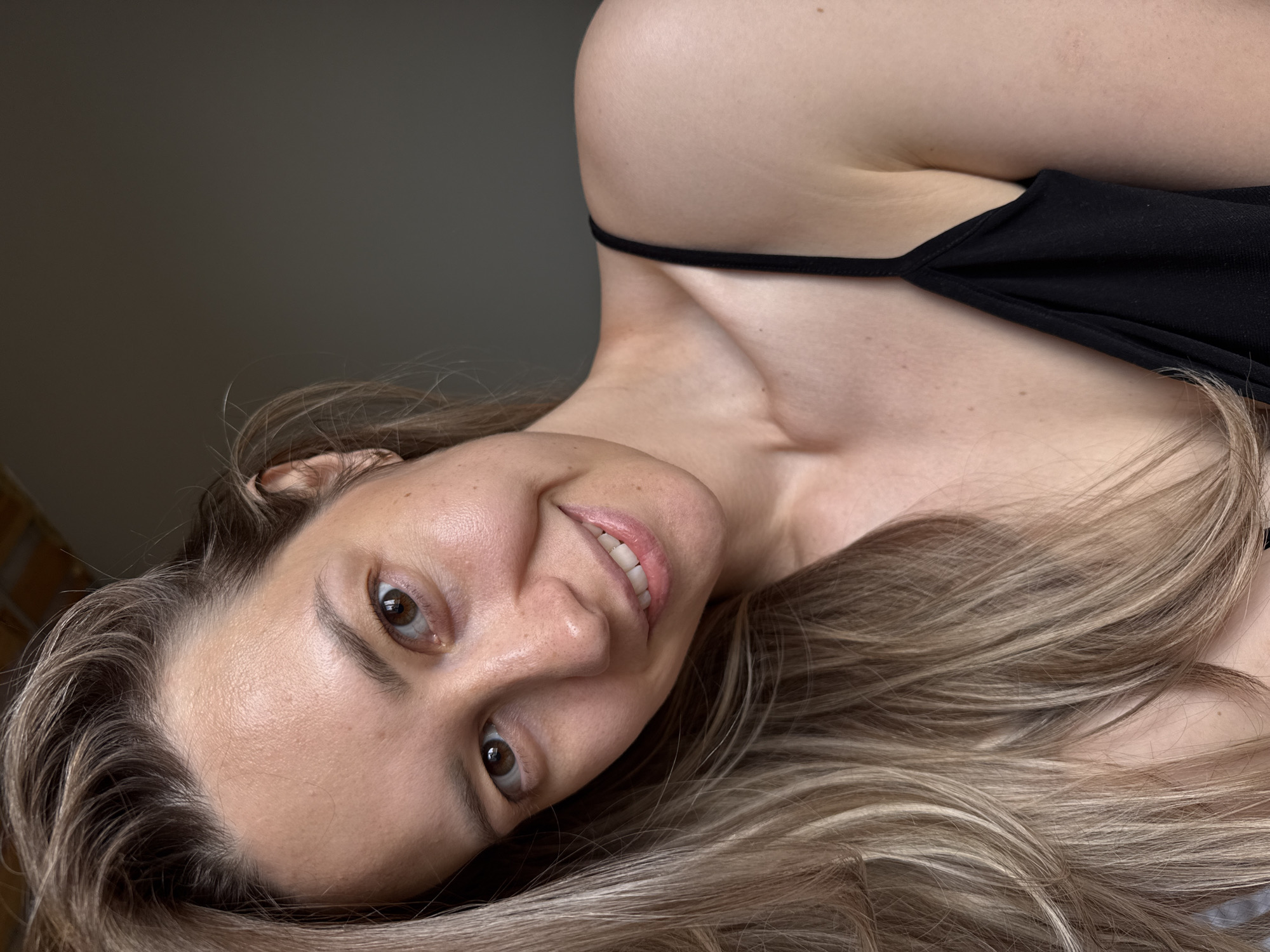 Woman photographed in multiple portraits in Chaikovsky indoor setting