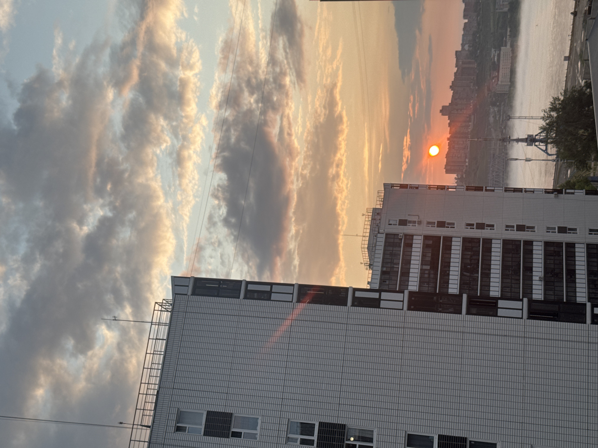 Sunset breaks over Krasnoyarsk's modern apartment skyline