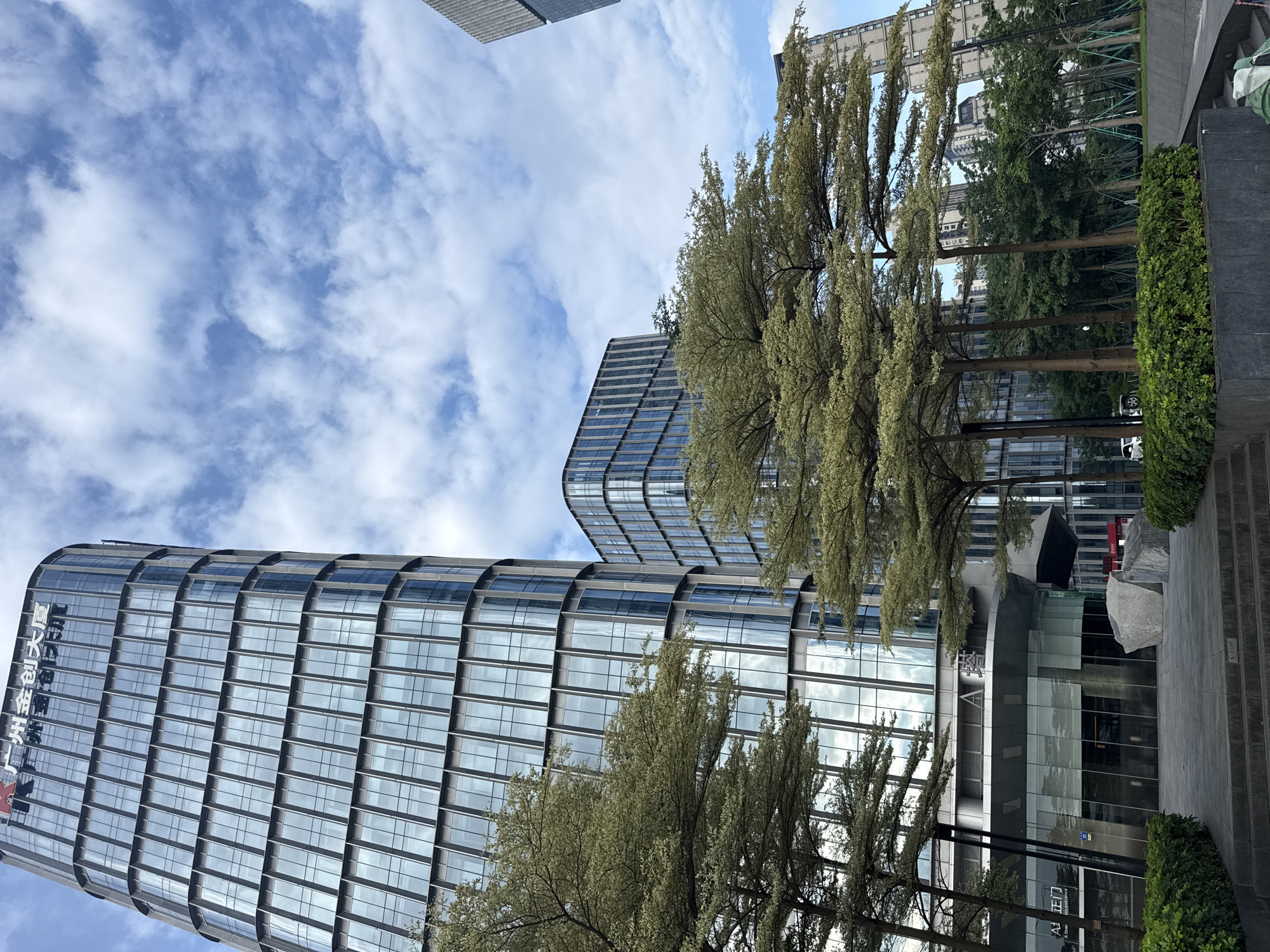 Street-level scenes around Haizhu District's glass tower precinct