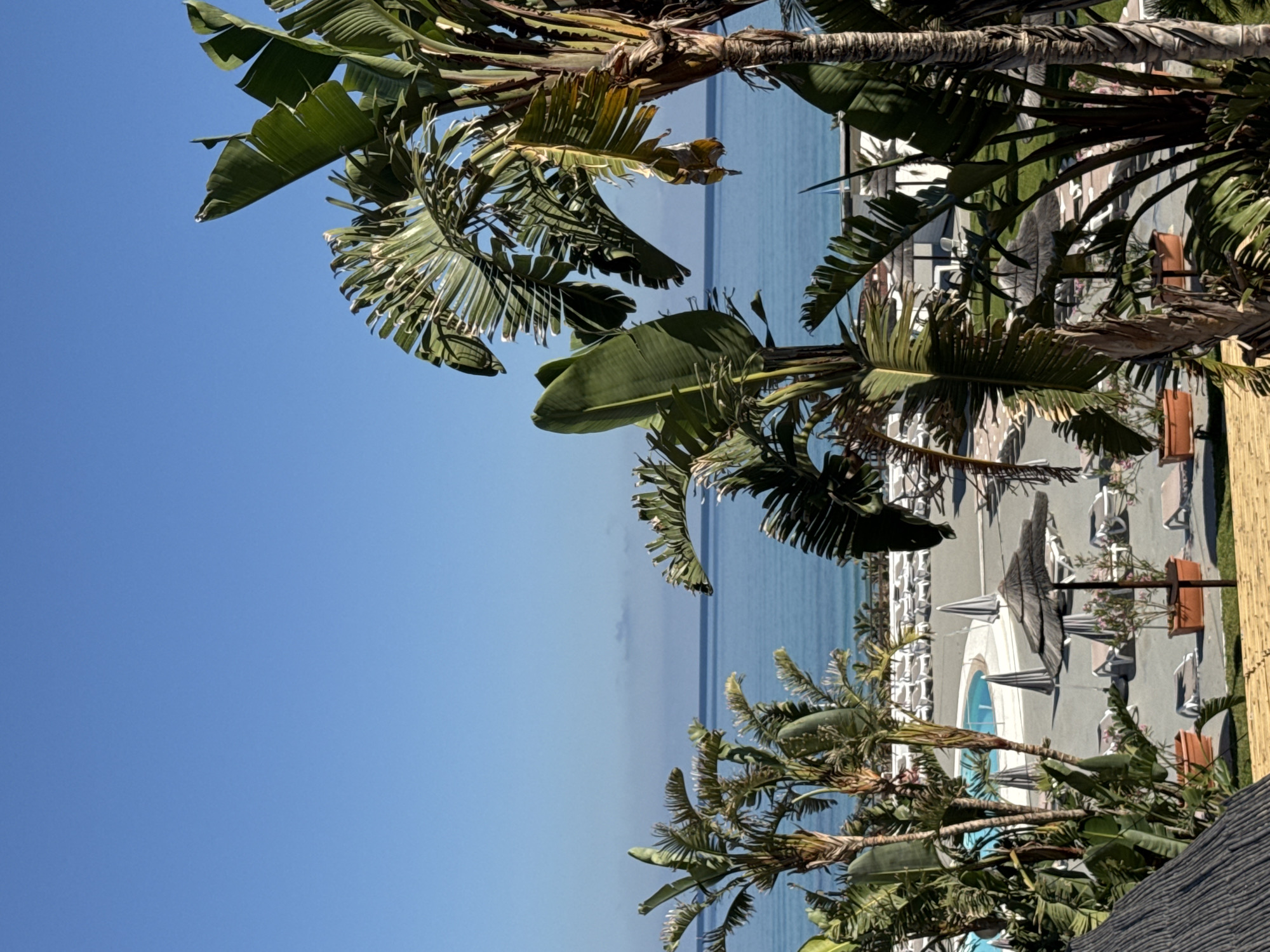 Sunny morning at a Sicilian coastal resort overlooking the Mediterranean