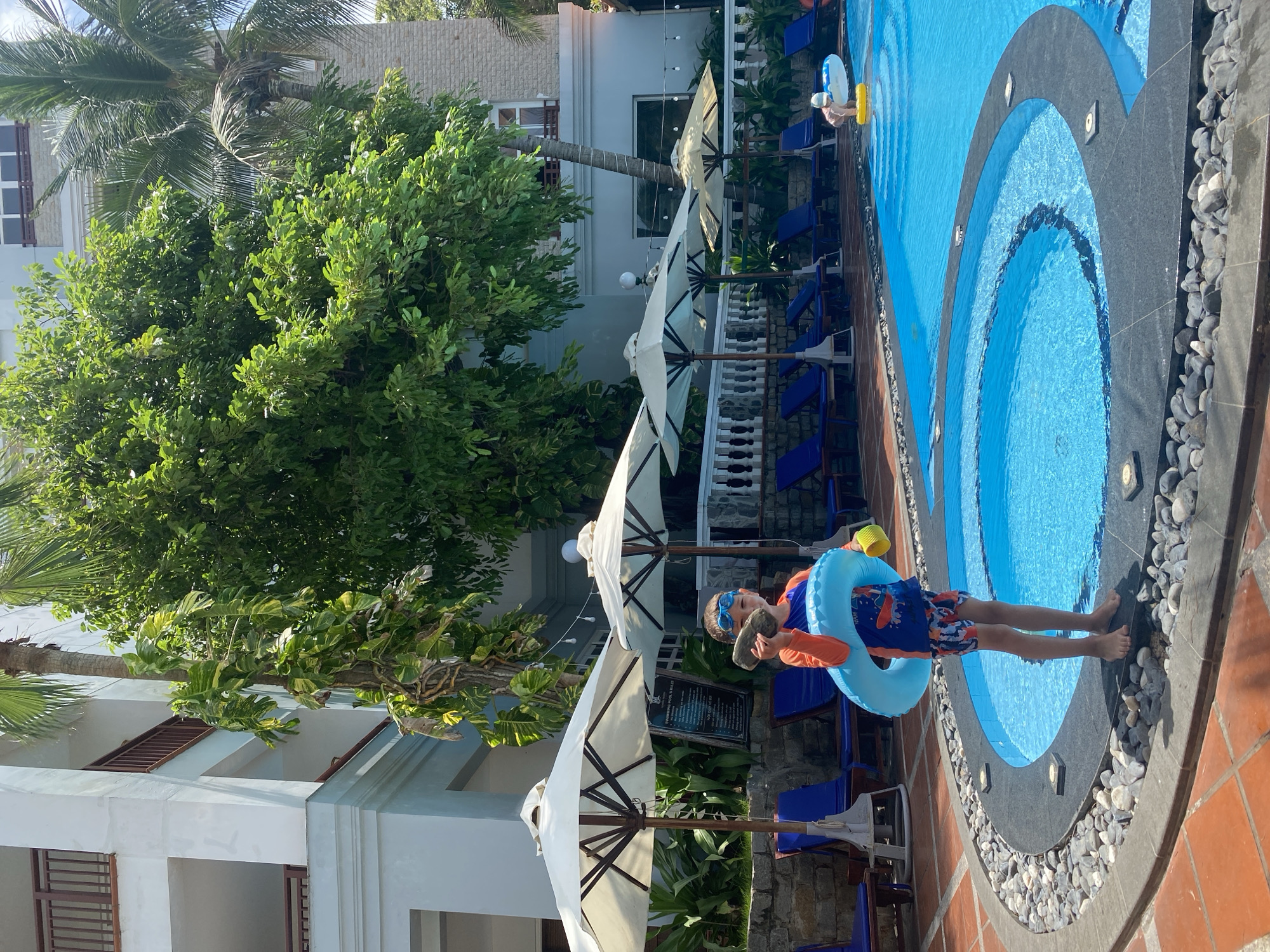 Beach and pool leisure activities documented in Phu Thuy Ward