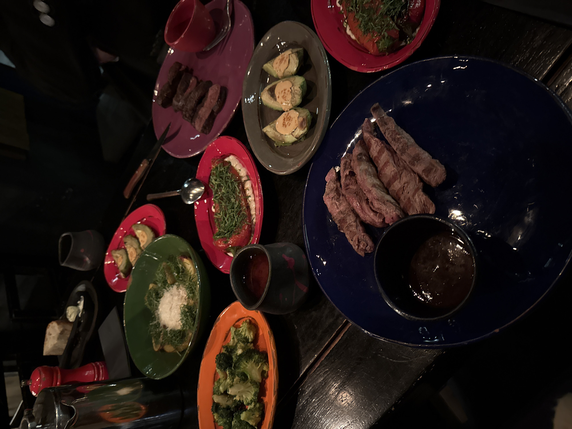 Candlelit dinner documented at Moscow restaurant featuring colorful plates