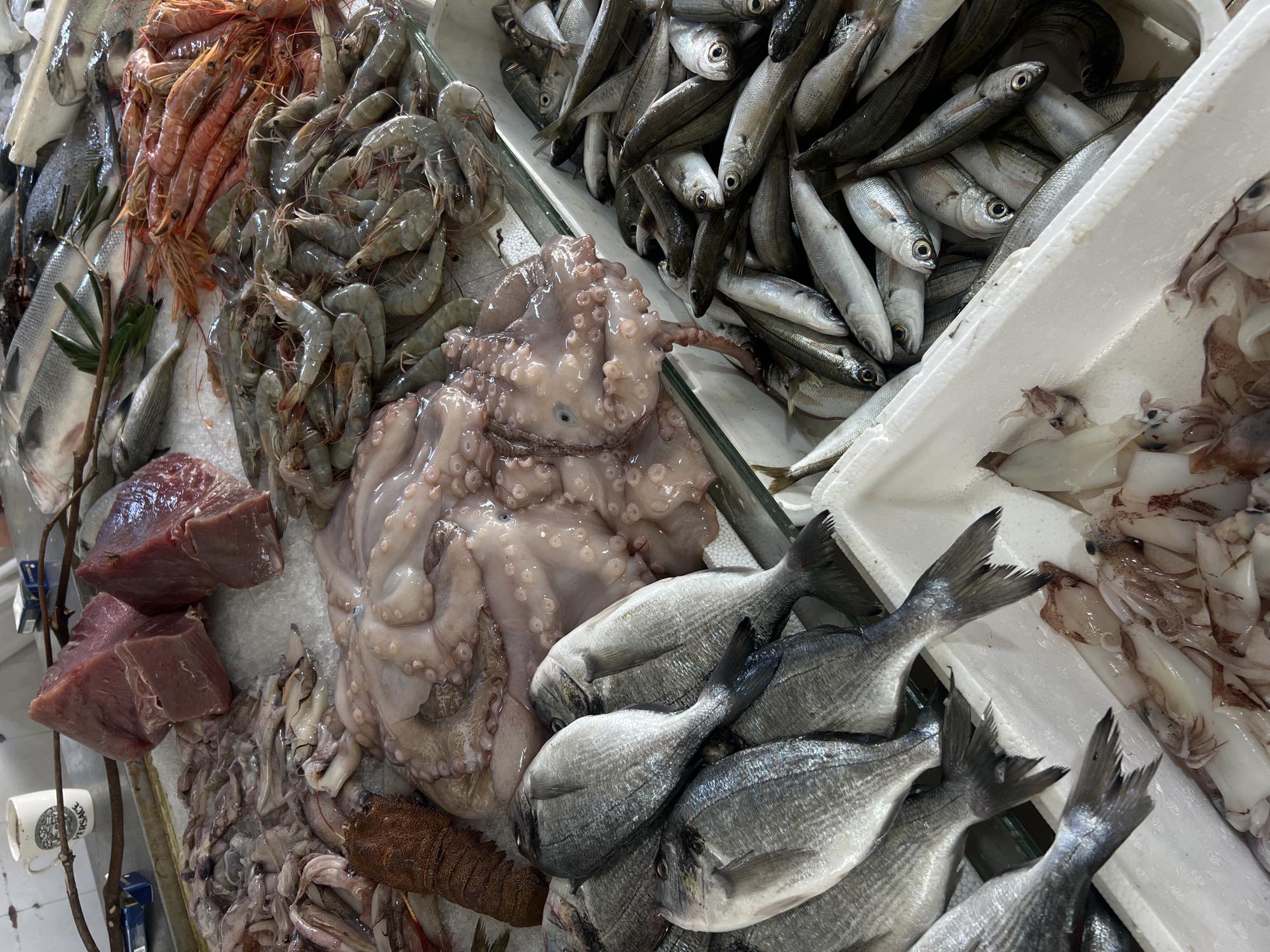 Fresh seafood at a covered outdoor market in Montenegro