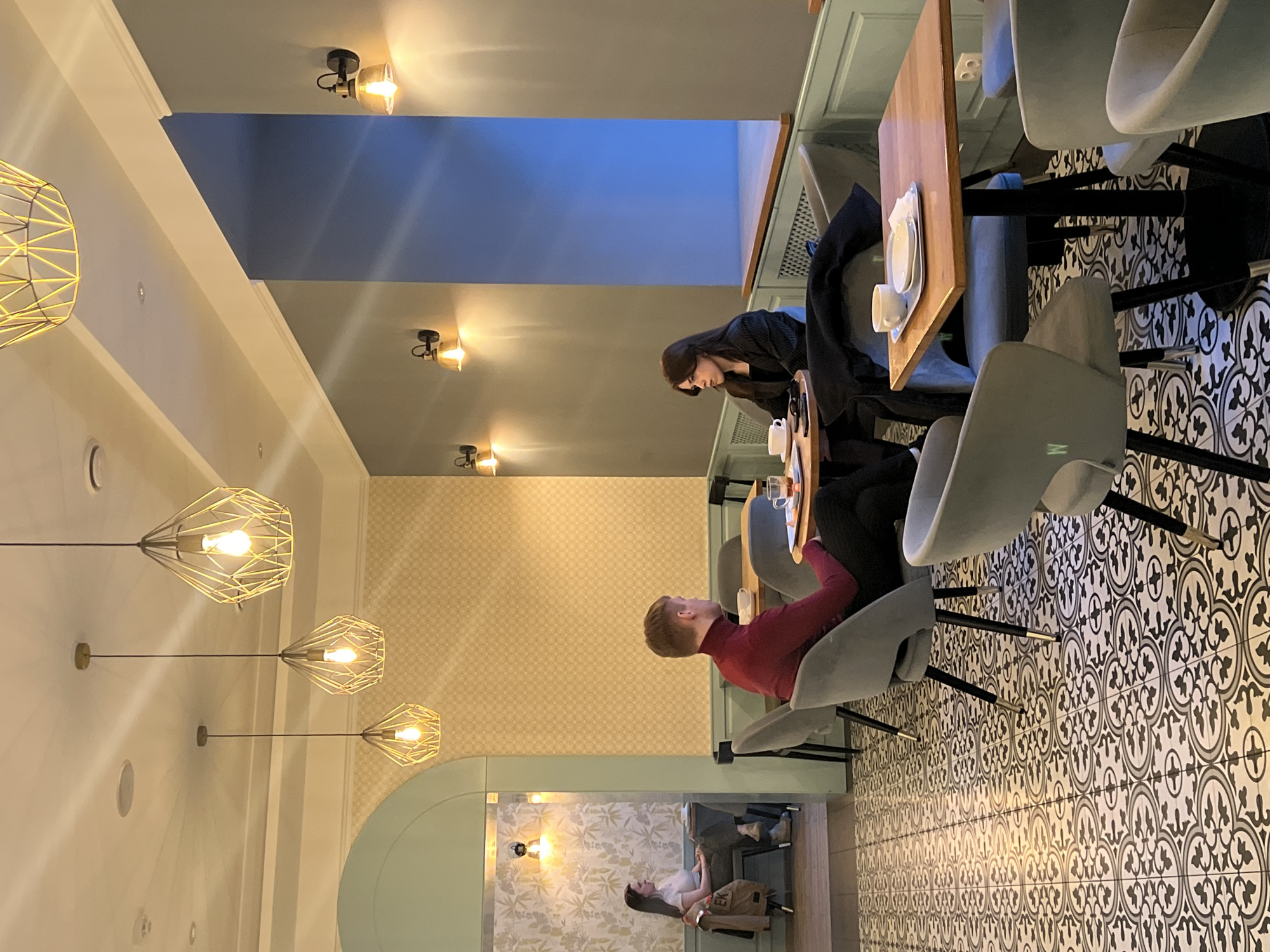 Cafe dining and pastry browsing captured in Minsk