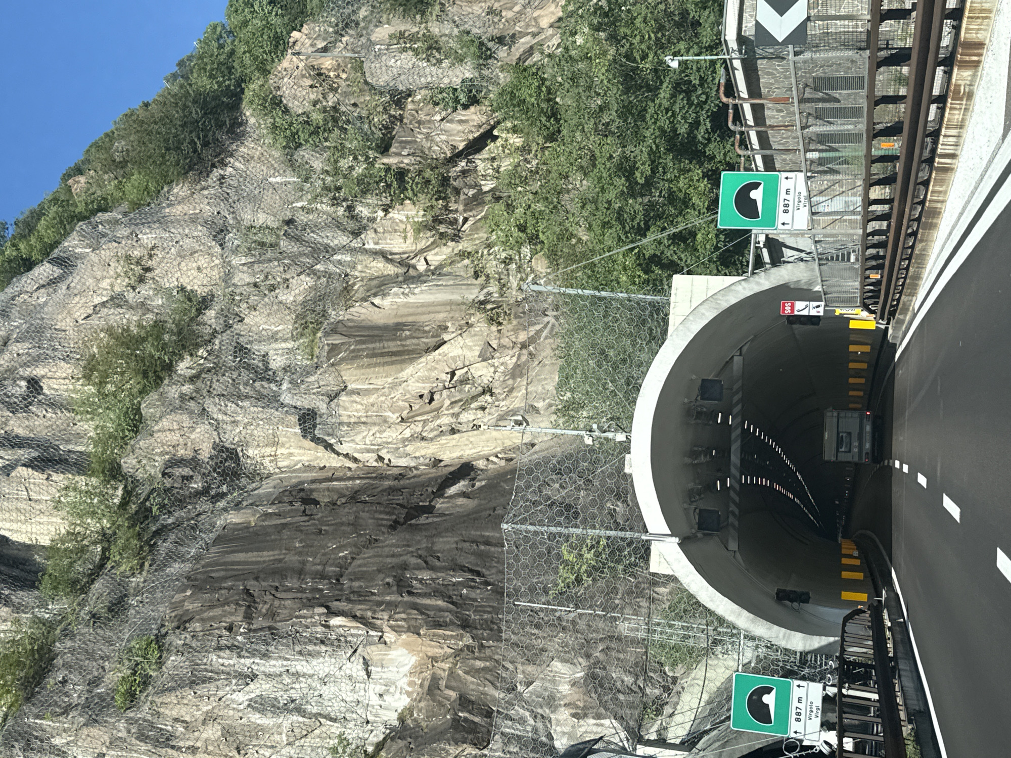 Castle ruins and mountain tunnels along a dramatic clifftop route