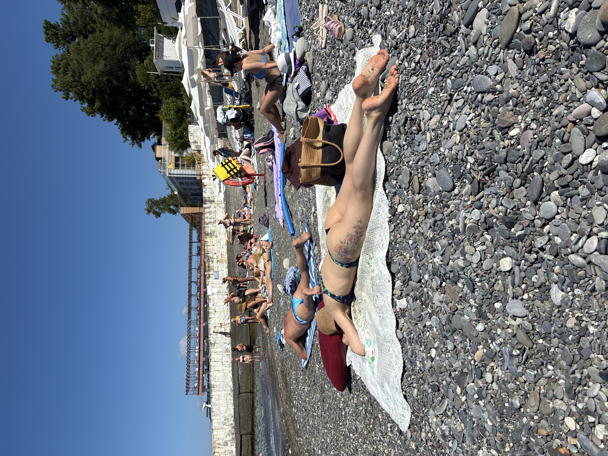 Sochi's Black Sea beach packed on a sunny summer morning