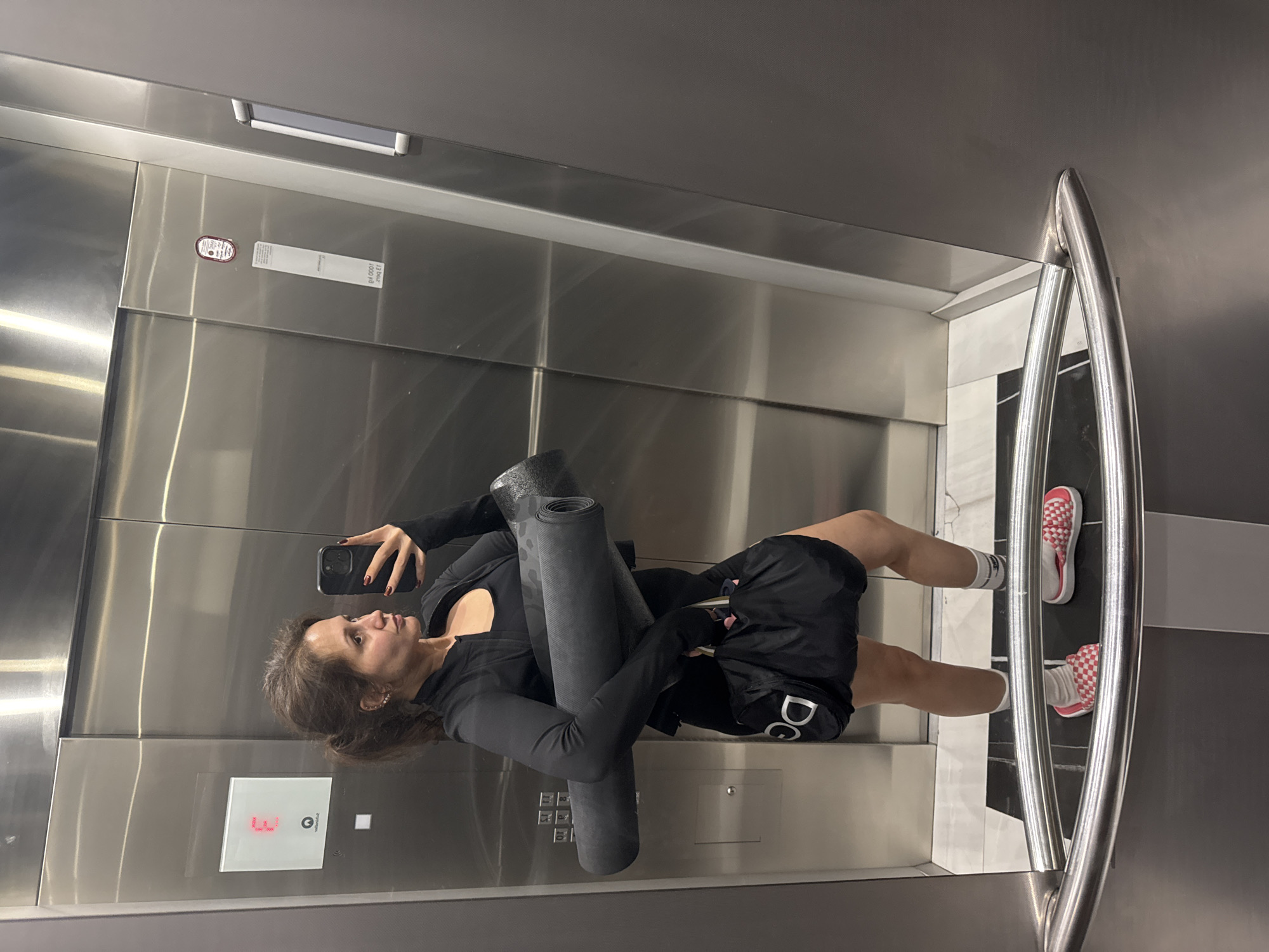 Woman Takes Mirror Selfie in Dubai Elevator
