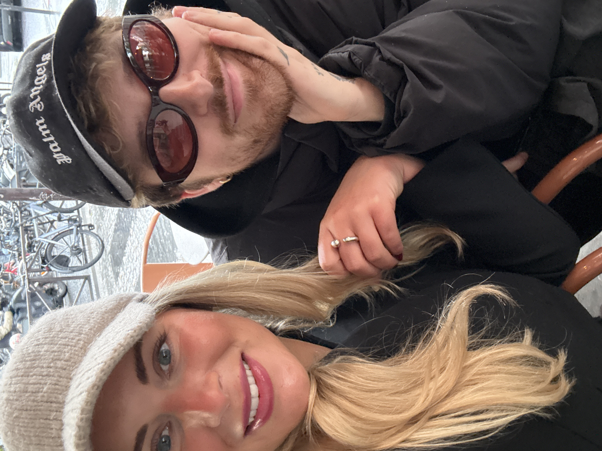 Couple enjoys afternoon at Parisian sidewalk cafe