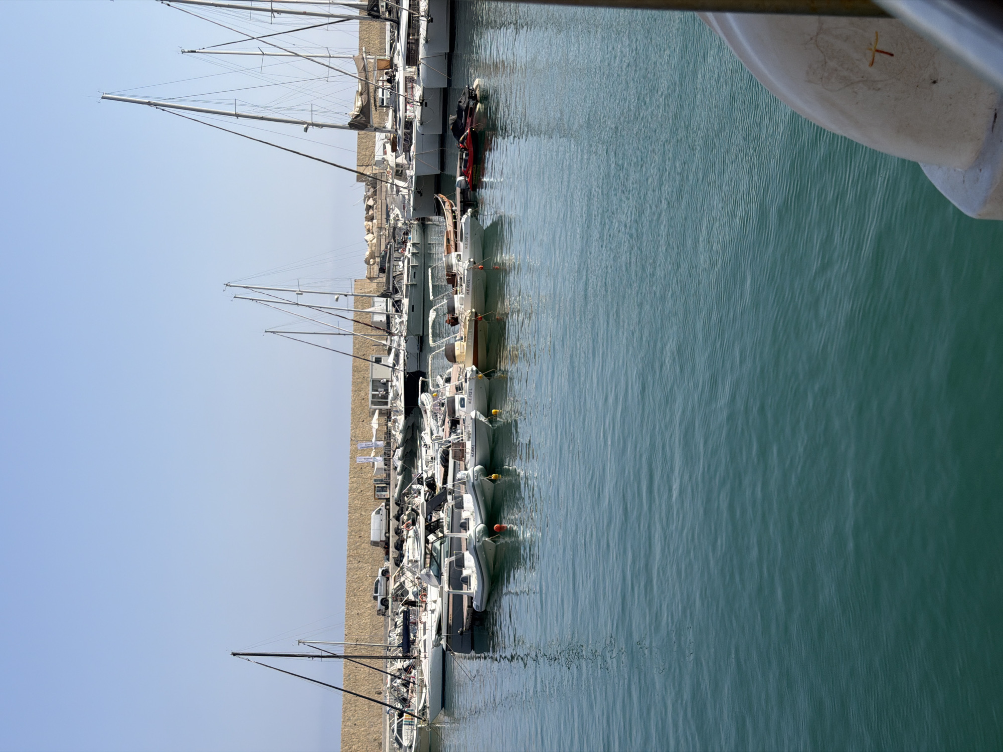 Leaving Castellammare del Golfo's marina by boat on a clear morning