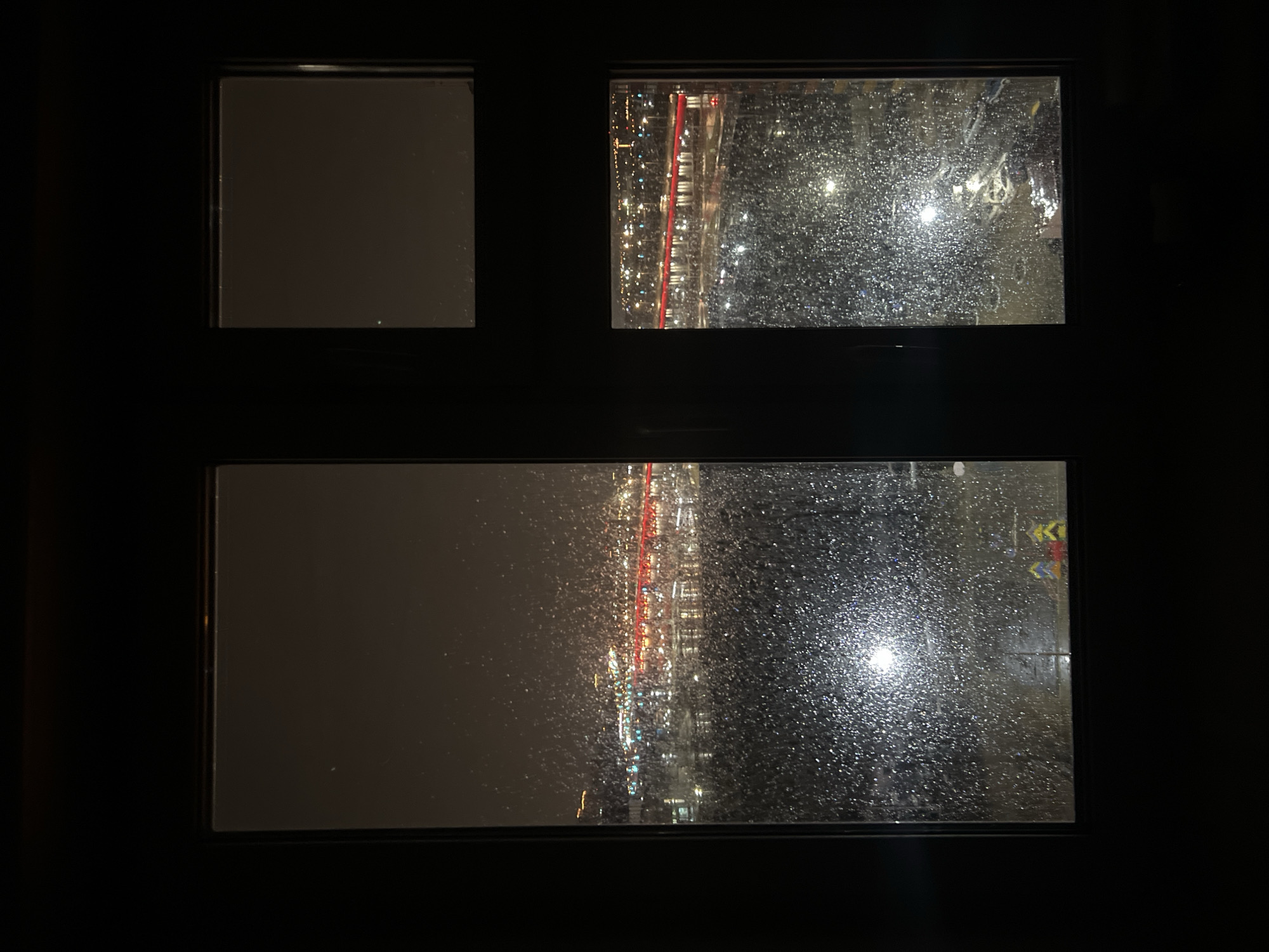 Rainy evening views captured through windows in Krasnoyarsk