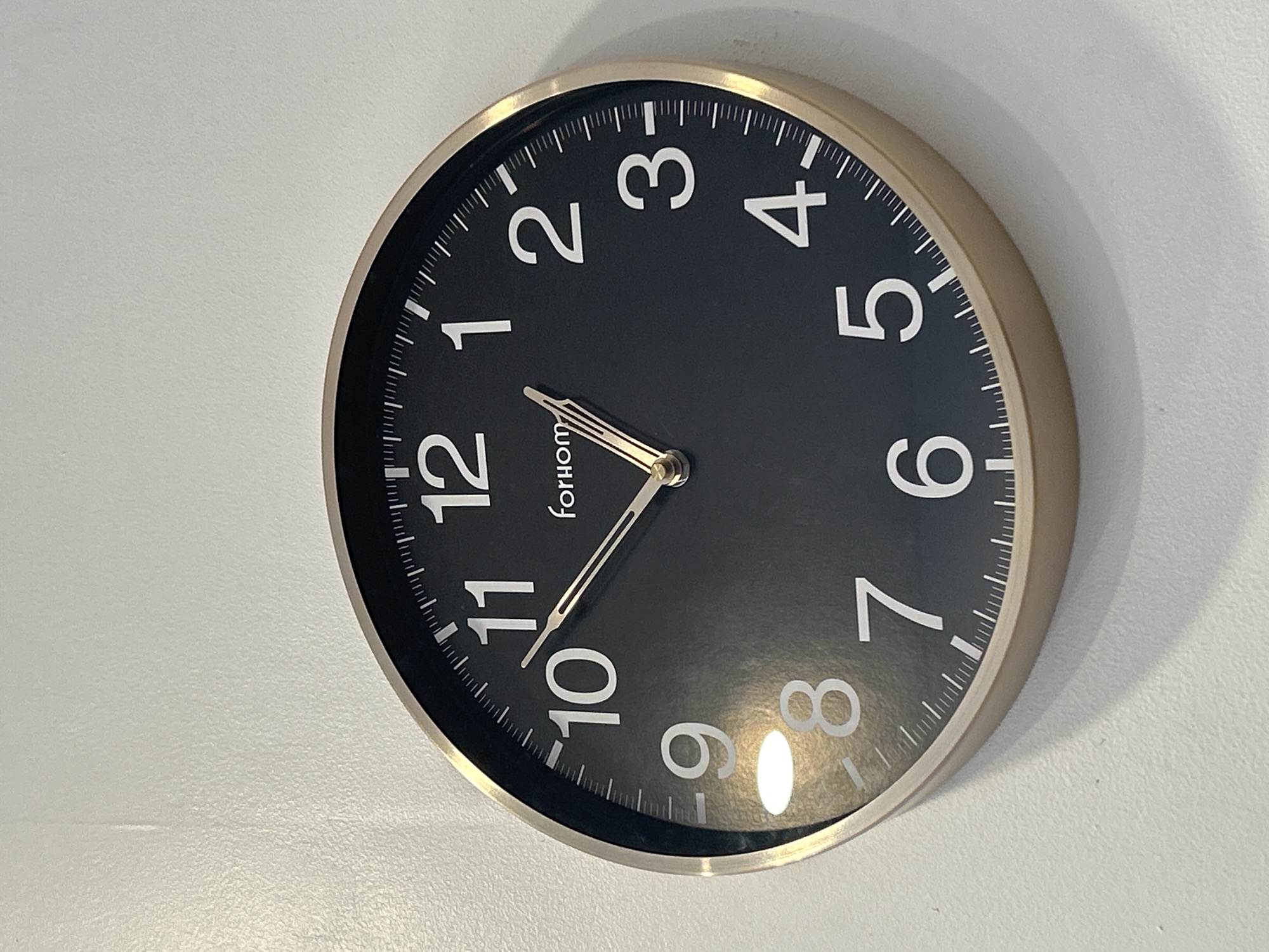 Indoor details: clock, calendar, and shelf in one space