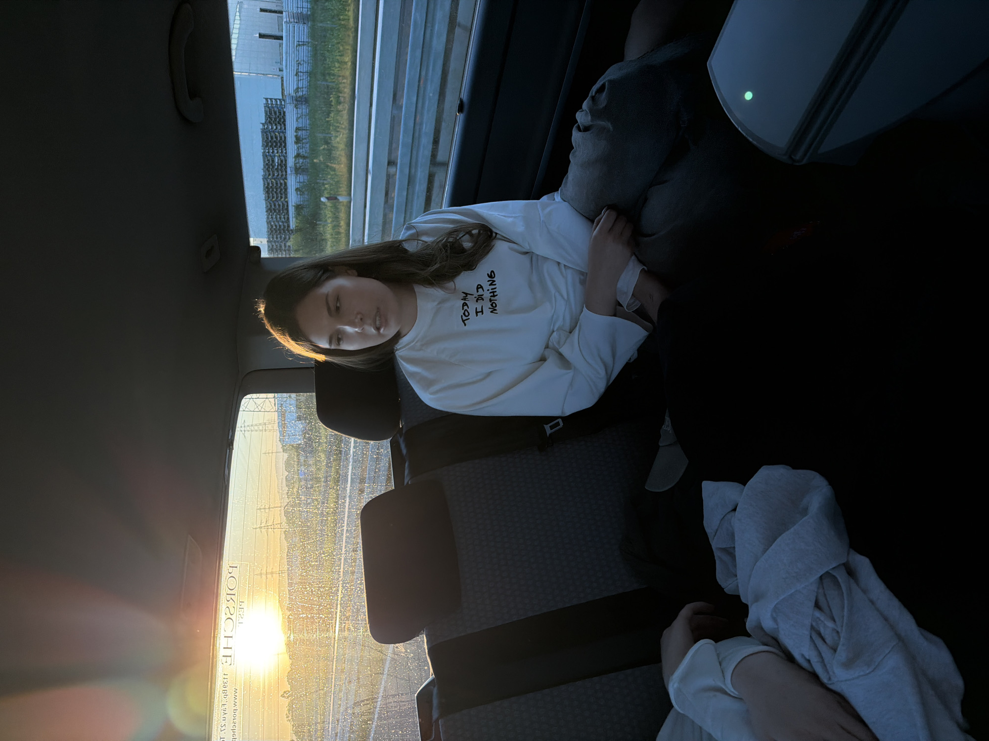 Woman photographed in vehicle during sunset in Loznica, Serbia