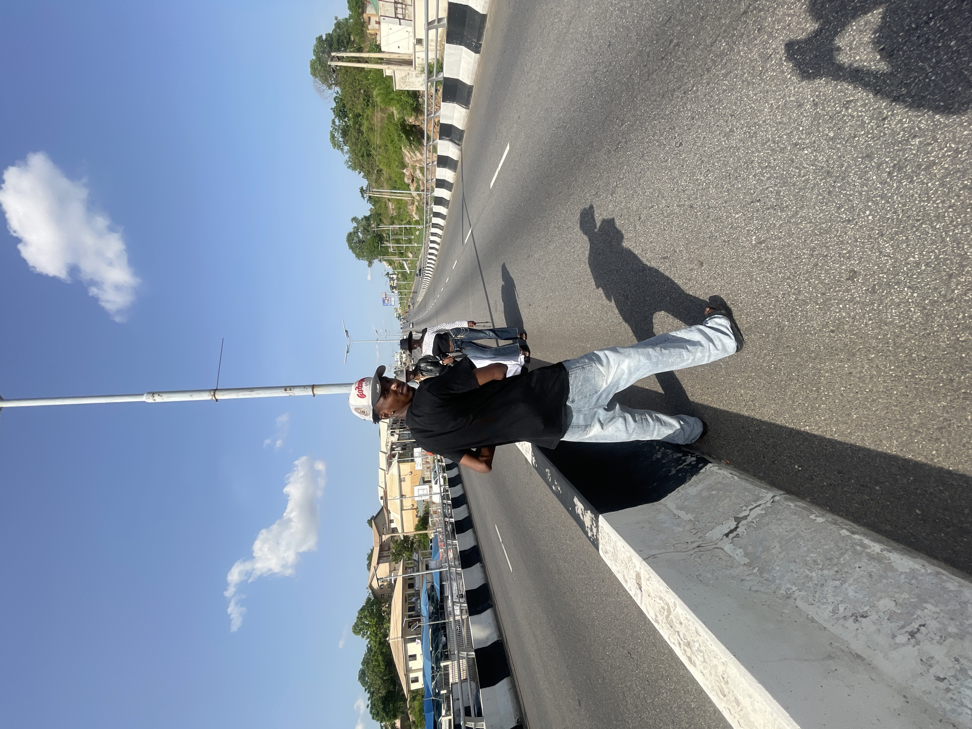 People gather on highway overpass in Lokoja, Nigeria