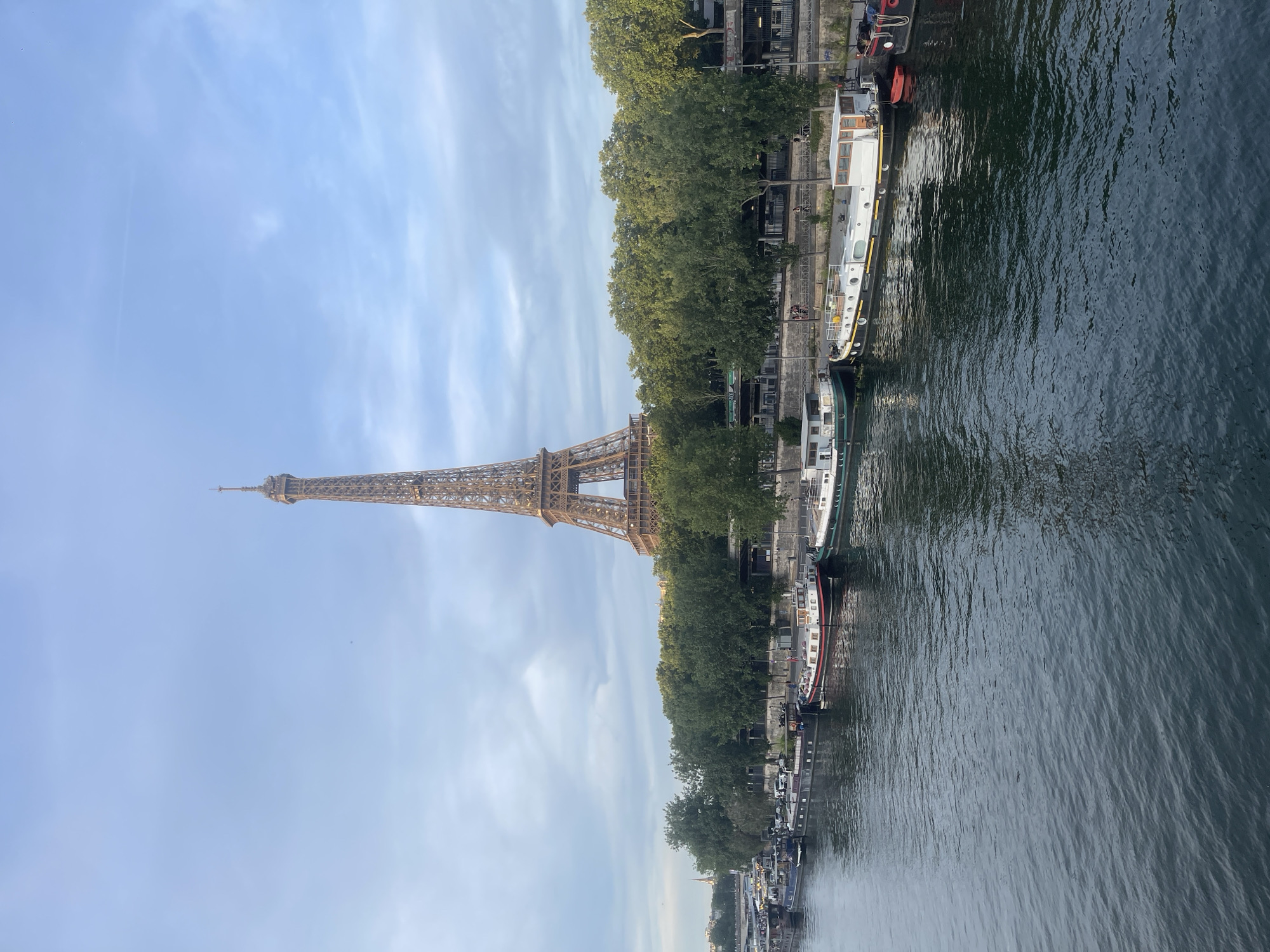 Romantic setup near the Eiffel Tower with a pink limo and candles