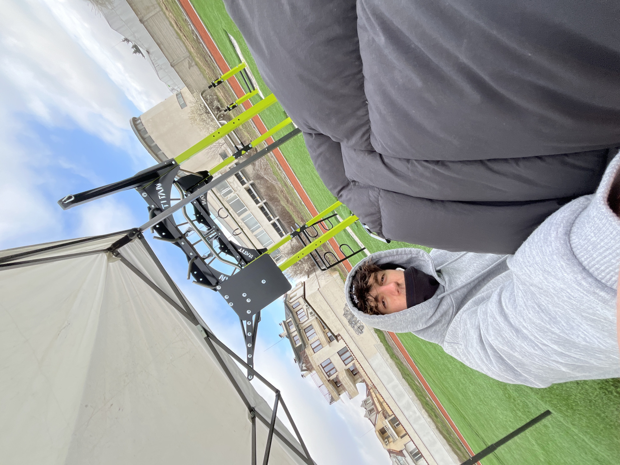 Person takes selfie wearing hoodie and face covering in Sofia