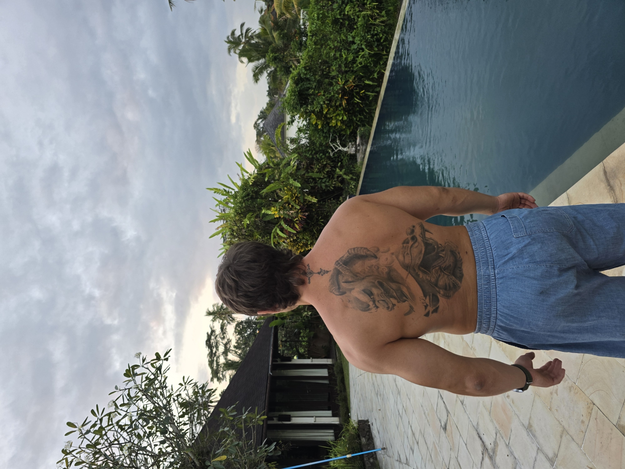Tropical poolside moments captured by single witness