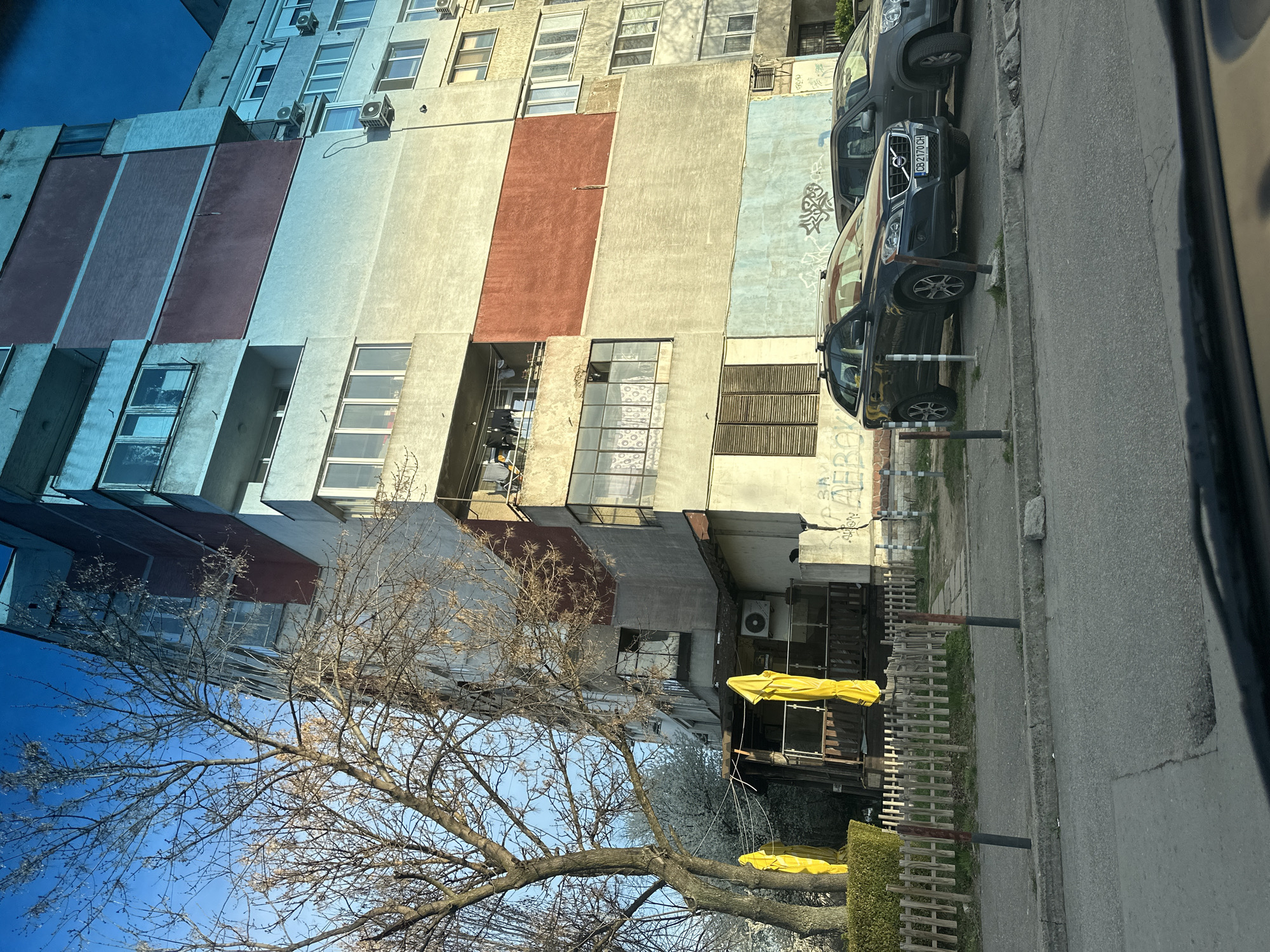 Everyday moments documented in Sofia: apartment building, mirror selfie
