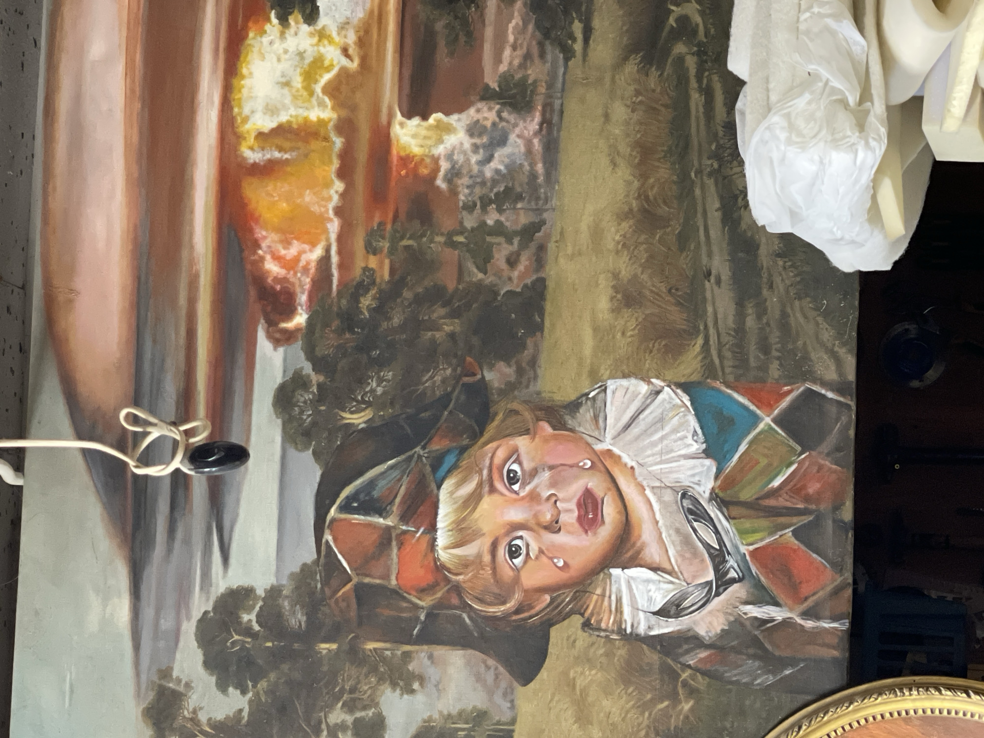 Antique furniture, art, and décor browsed in a cluttered resale setting
