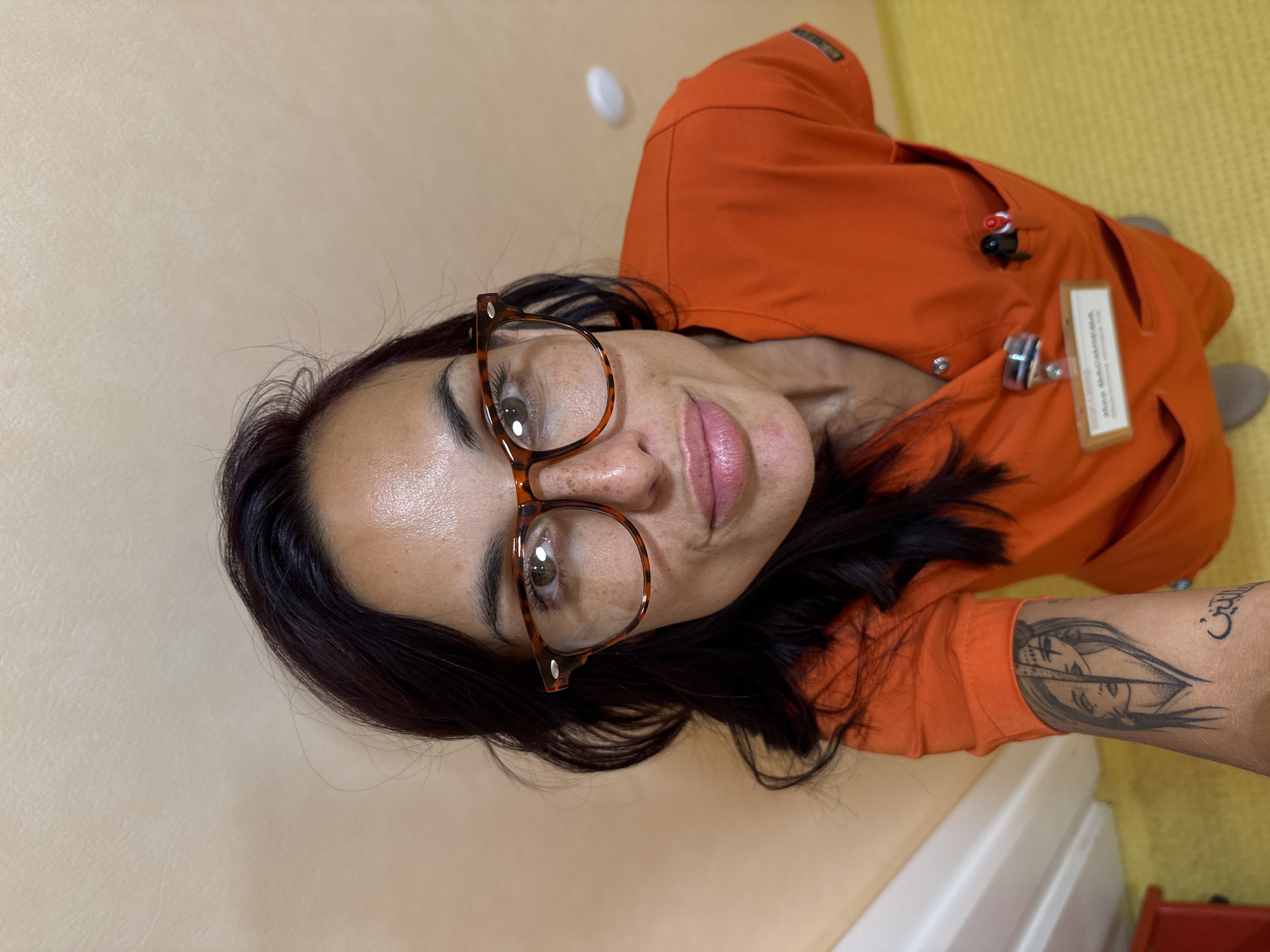 Quick selfies in orange scrubs at a Pleven healthcare facility