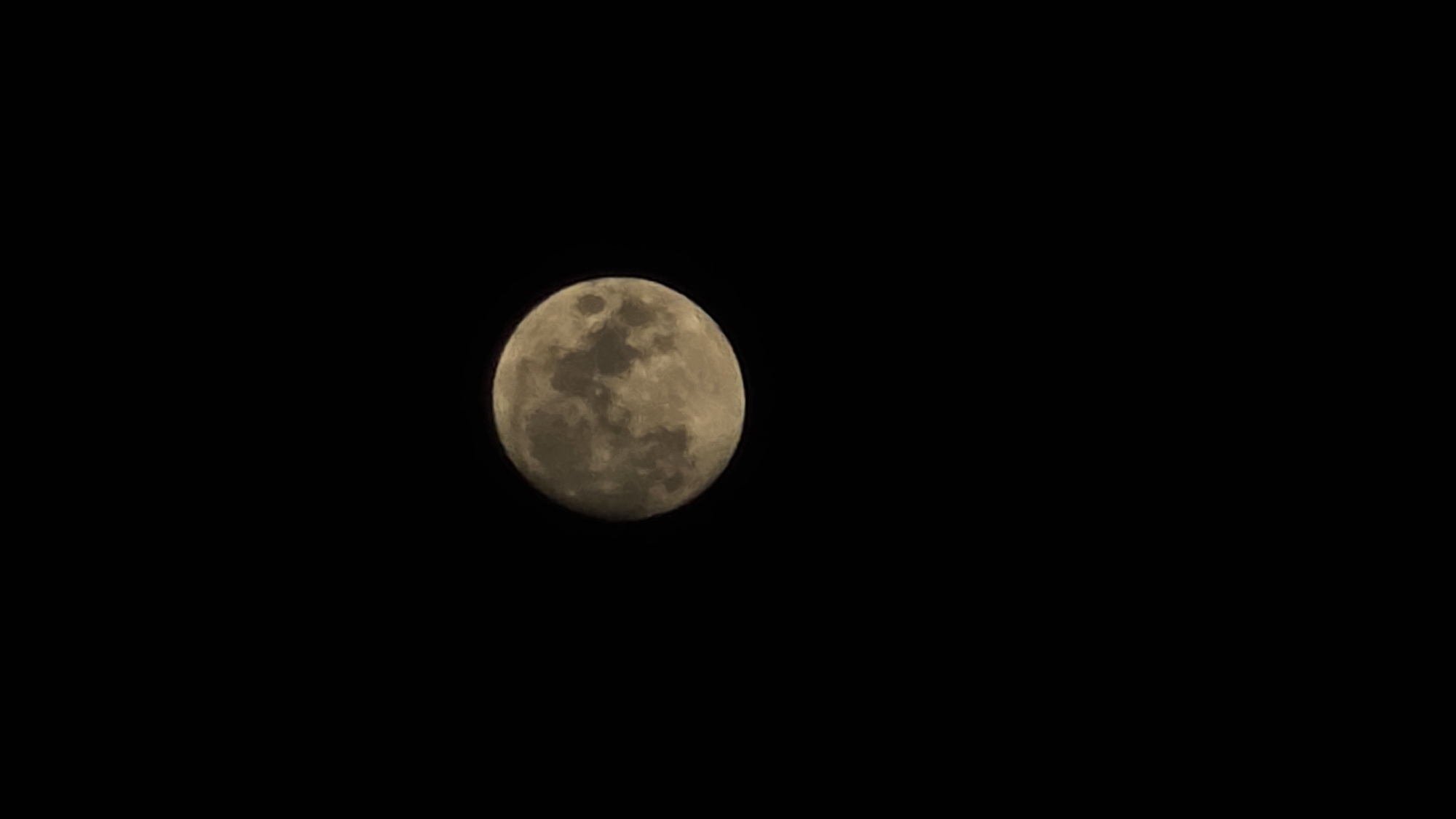 Full moon photographed against dark night sky