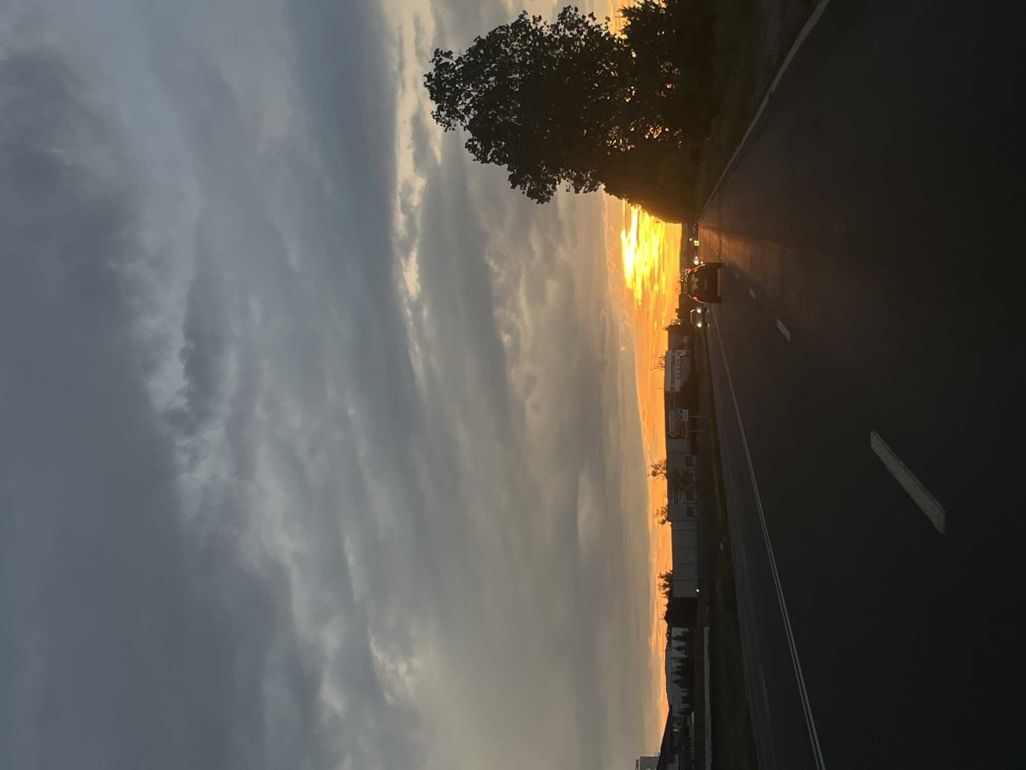 Dramatic sunset captured on Bulgarian road amid stormy skies