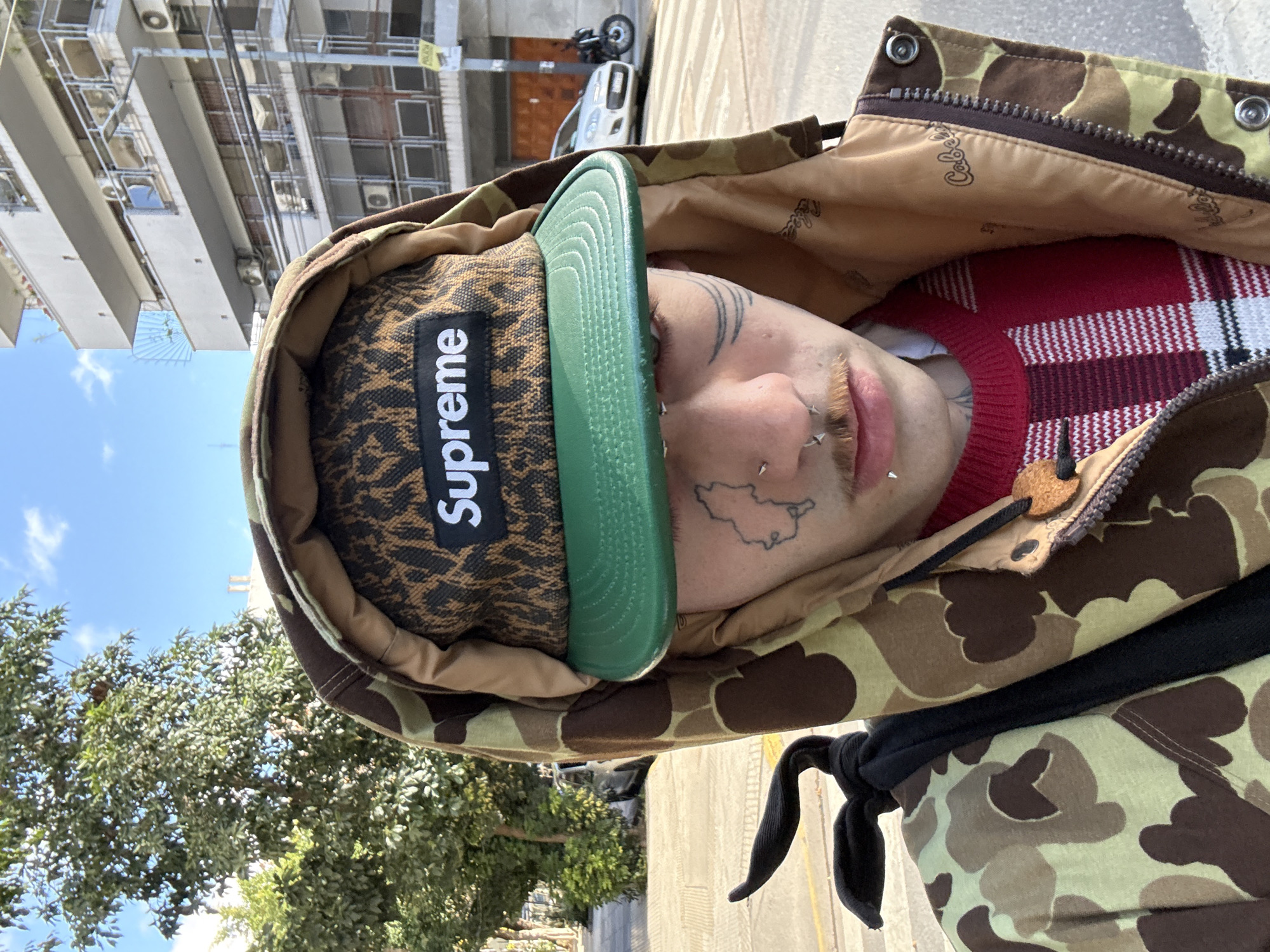 Person in Supreme hat, camo jacket spotted in Buenos Aires
