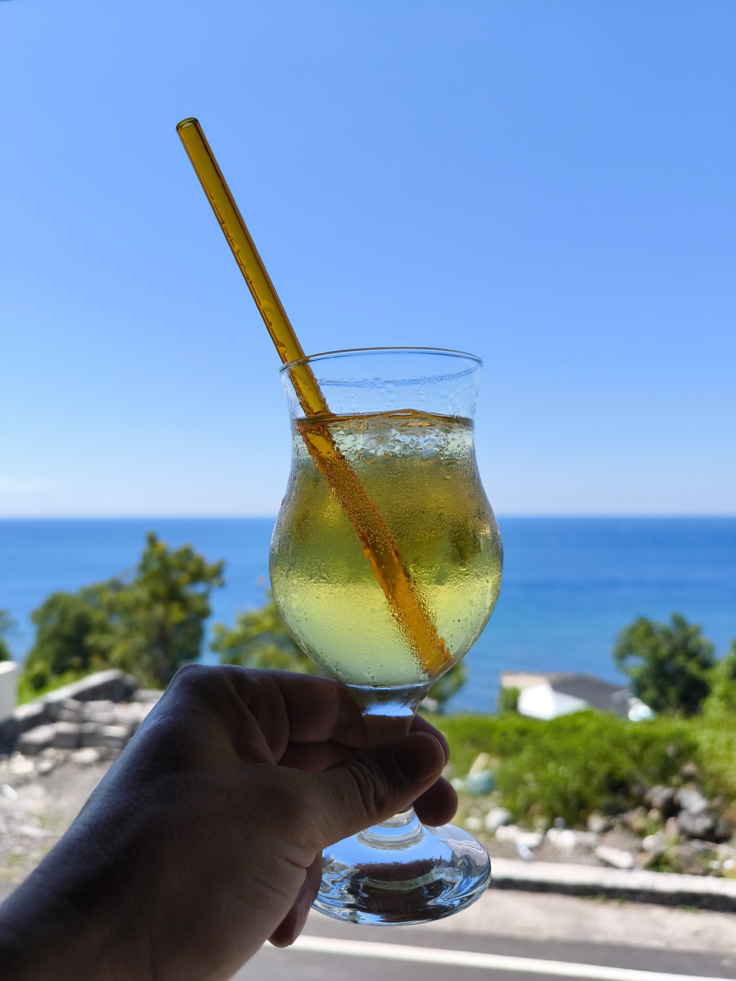 Cold beverage enjoyed at Indonesian coastal location
