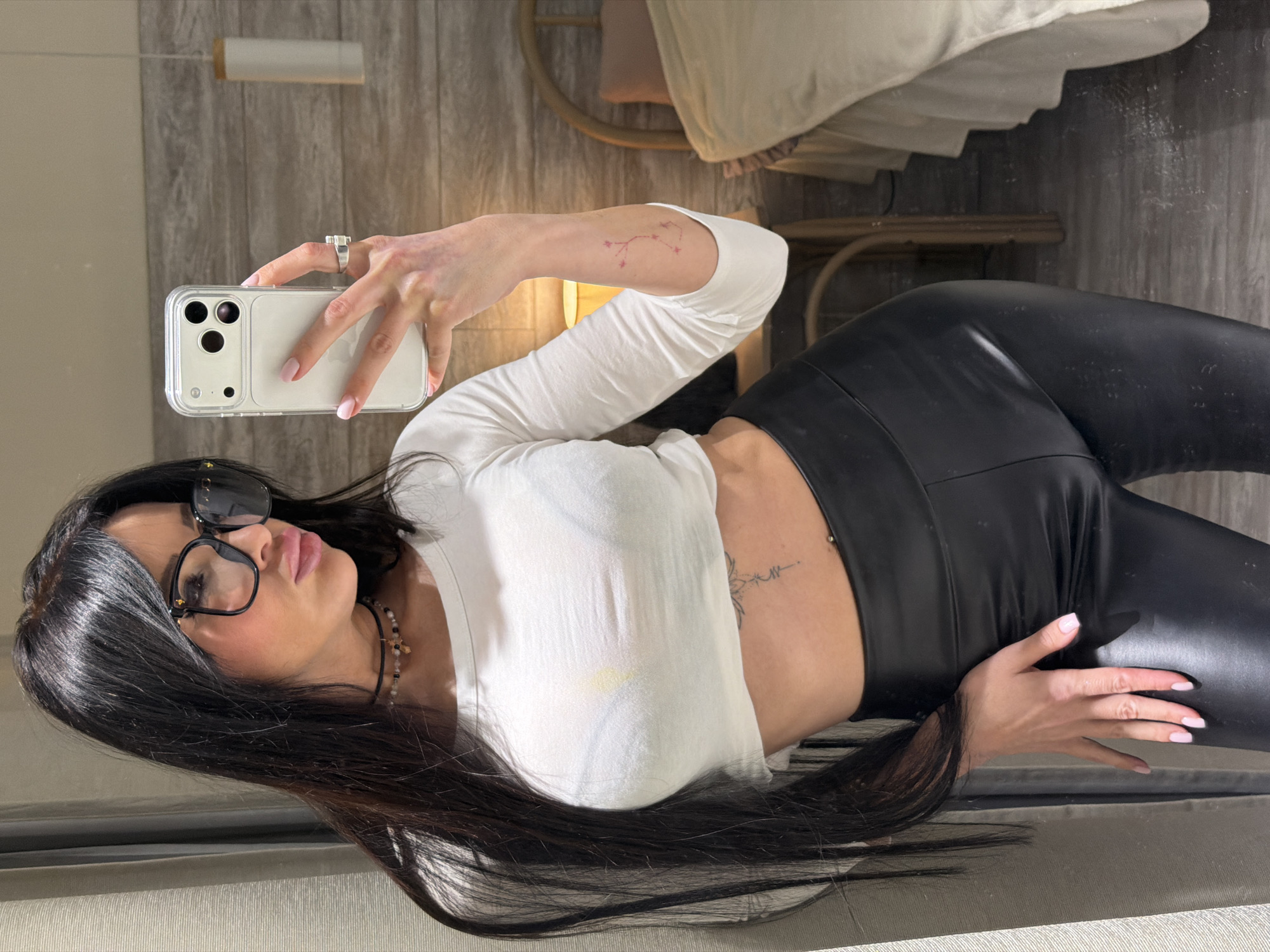 Woman takes rotated mirror selfie indoors in Moscow
