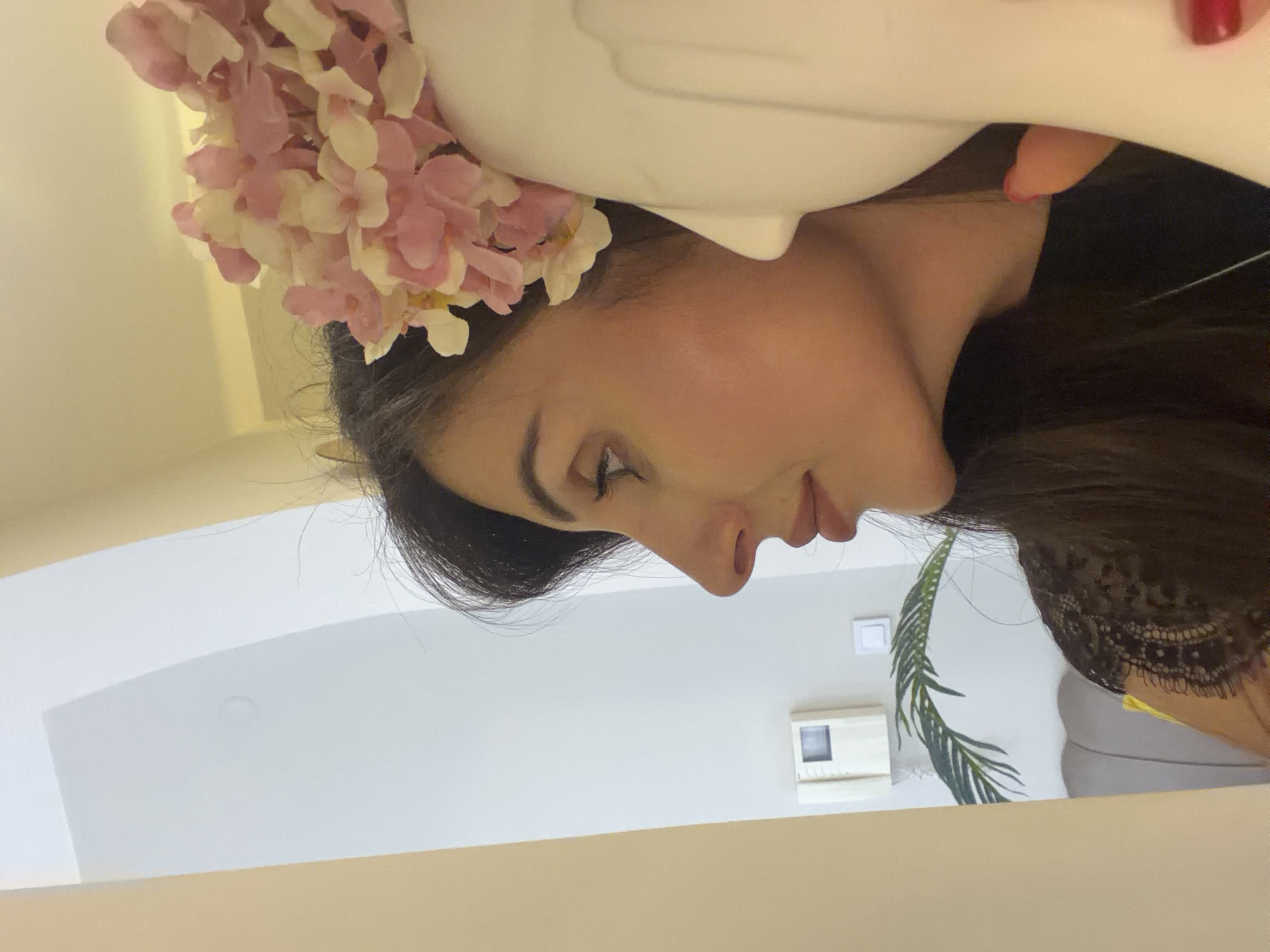 Woman takes multiple selfies indoors in Budva Montenegro