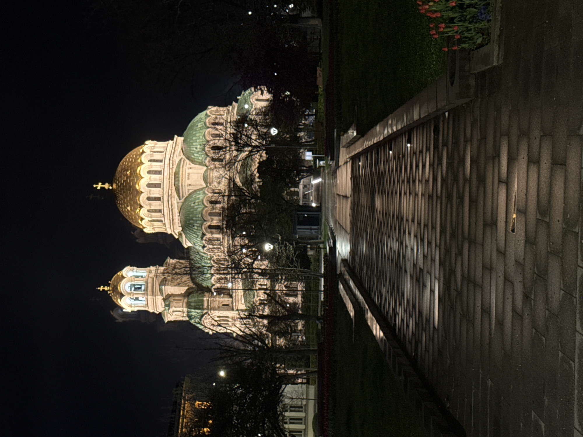 Sofia nightlife captured: cathedral illumination and indoor venue activity