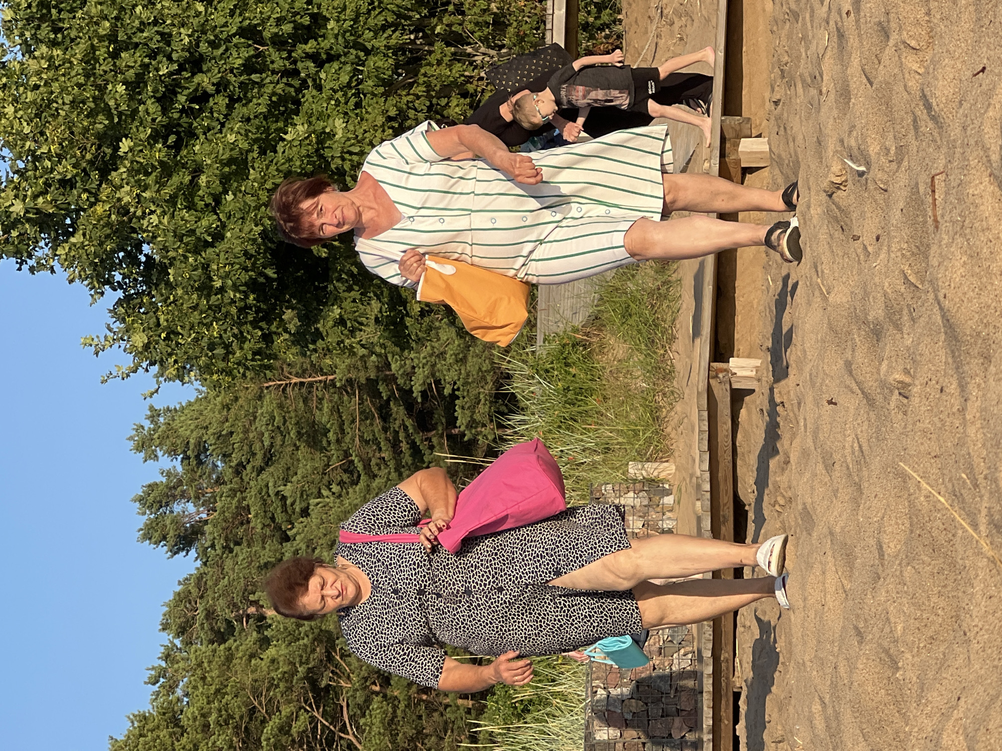 Beach afternoon wraps up with sunset swims and shoreside volleyball