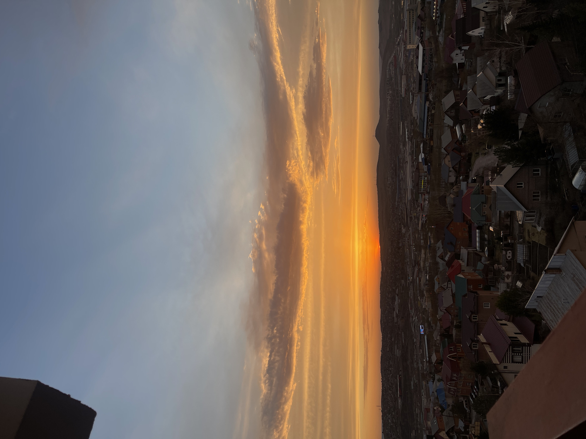 Evening sky observed over Krasnoyarsk residential neighborhoods