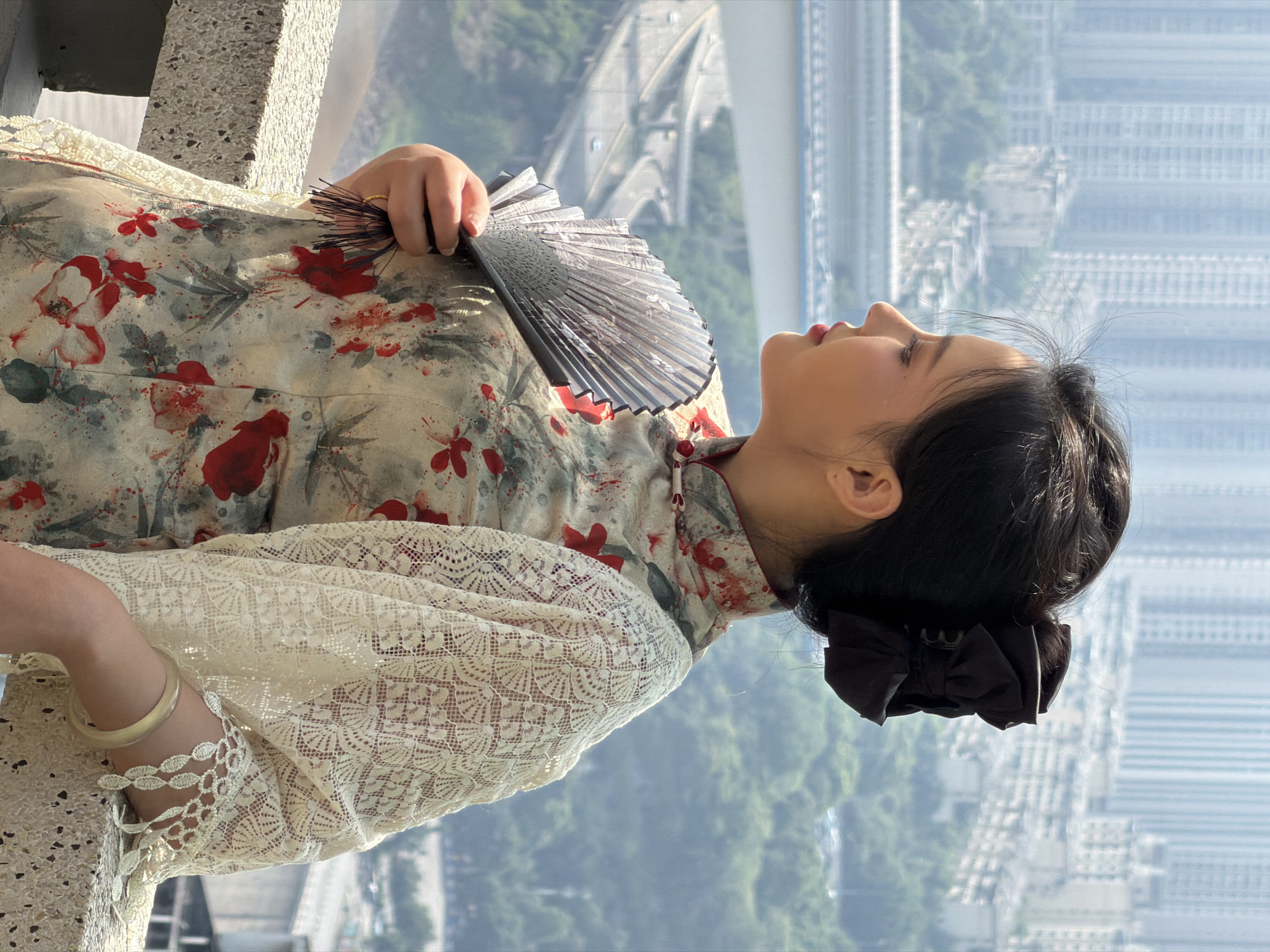 Woman in traditional qipao photographed in Yuzhong District