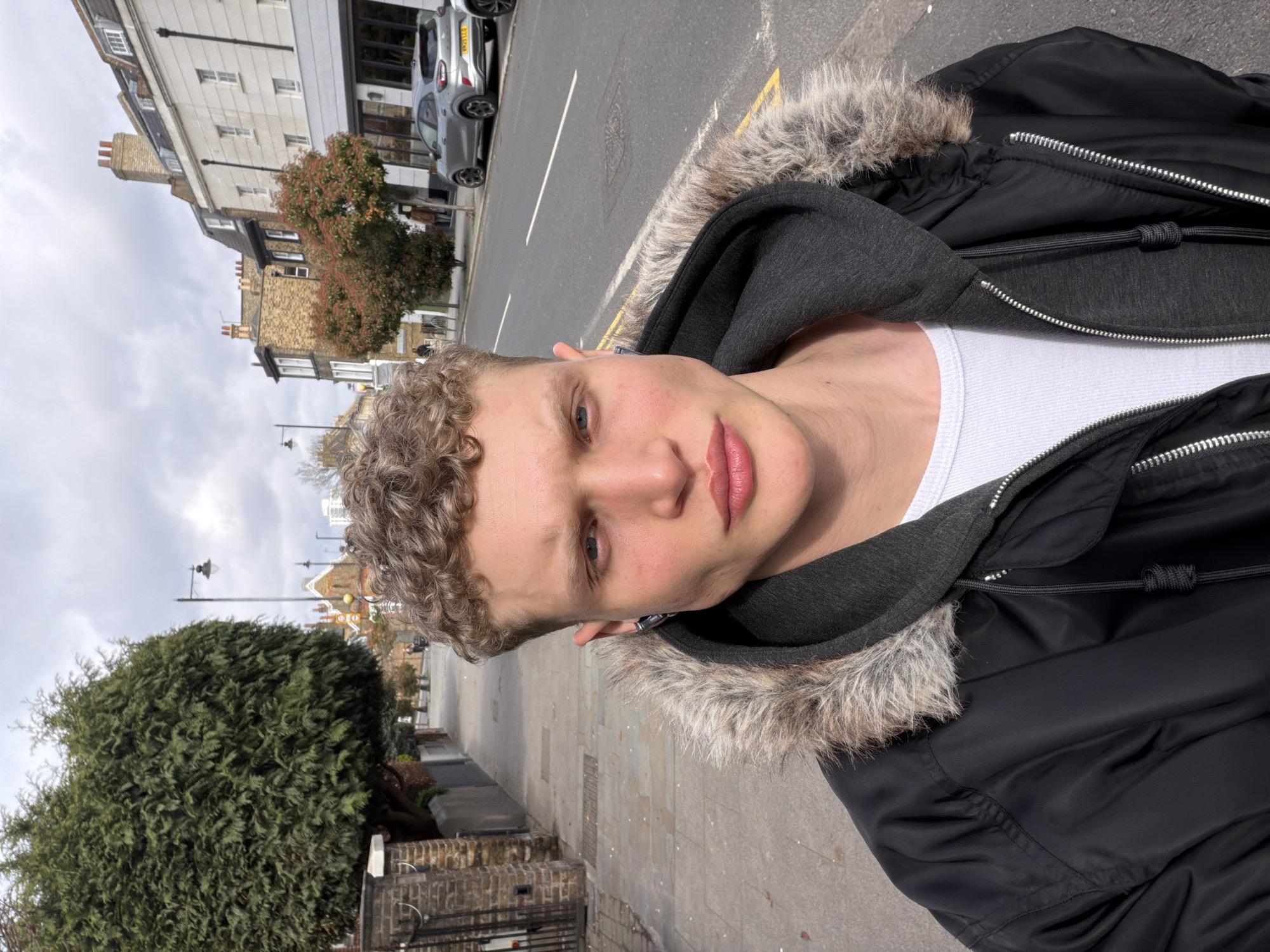 Young man in winter layers photographed in London