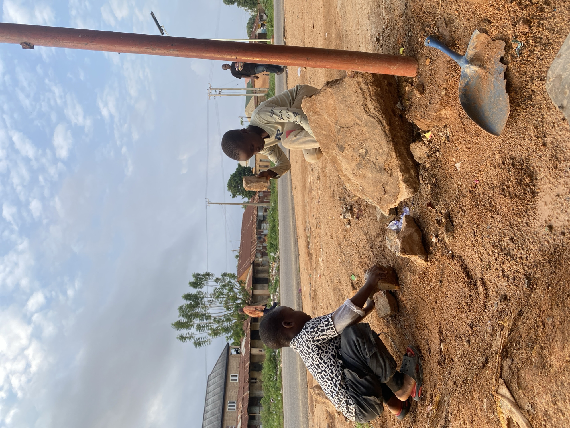 Children Play with Rocks, Balloons in Nigerian Towns