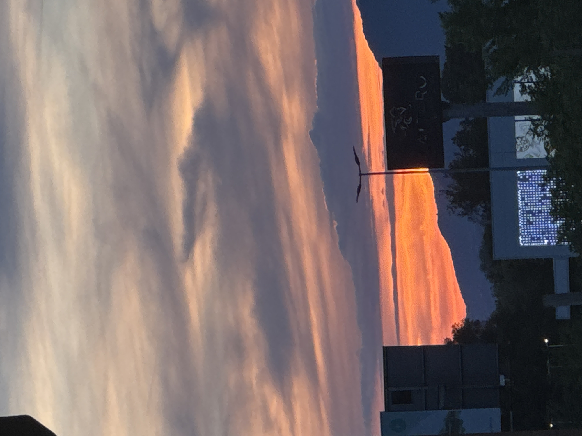 Sunset observed over Budva, Montenegro with orange cloud reflections