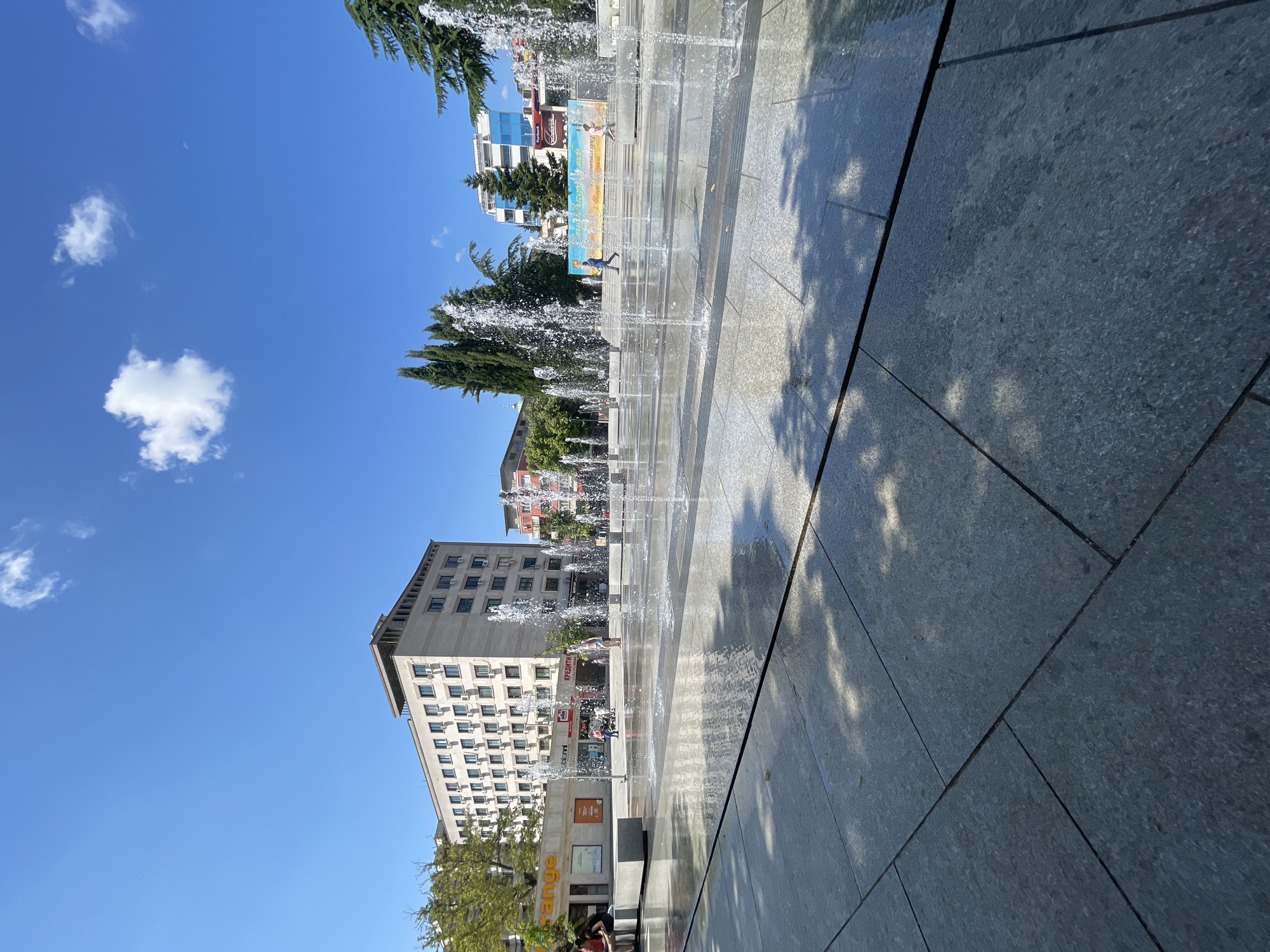 Stara Zagora's city square fountain running on a sunny morning