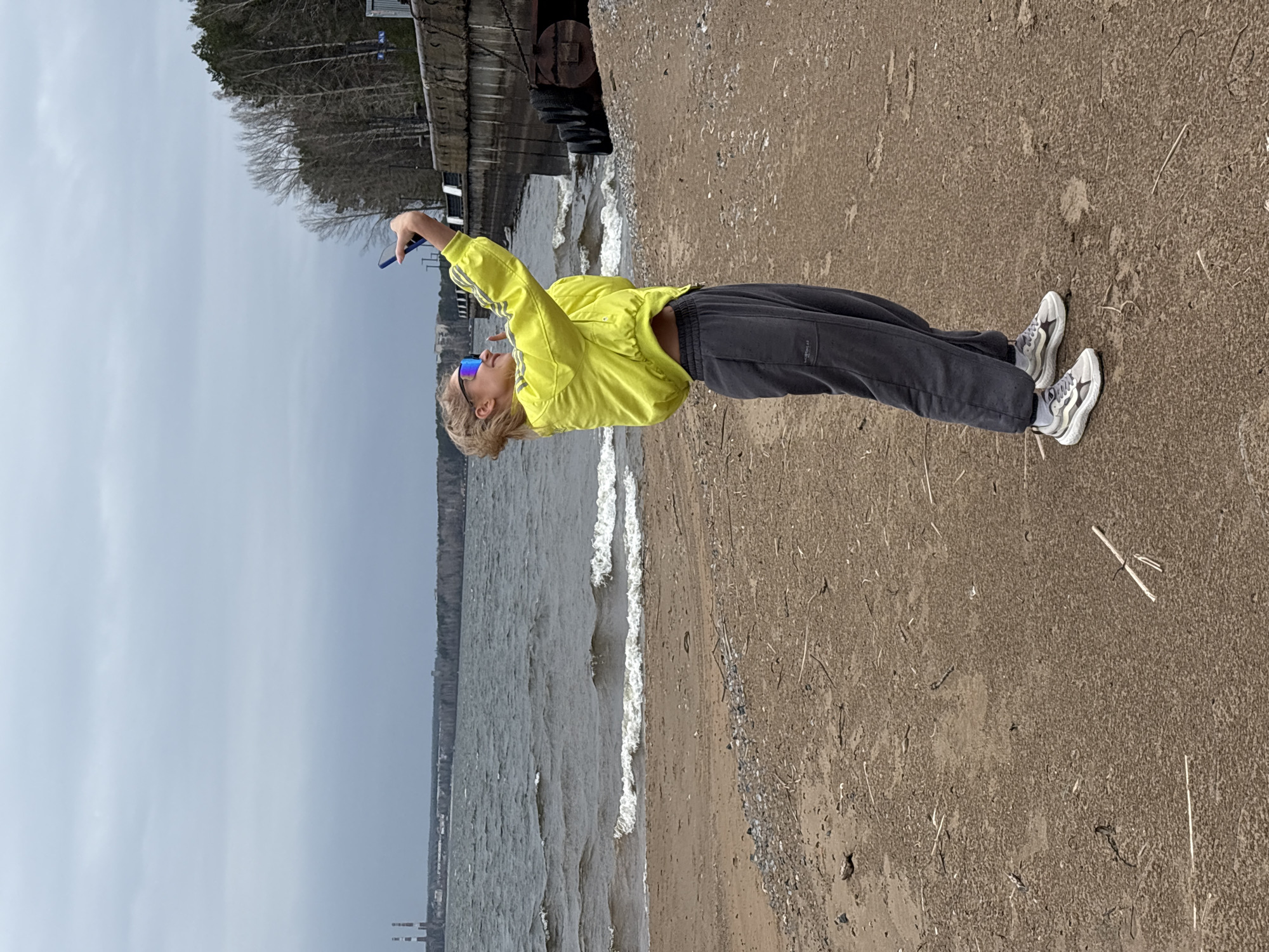 Woman enjoys morning riverside outing in Chaikovsky, Russia