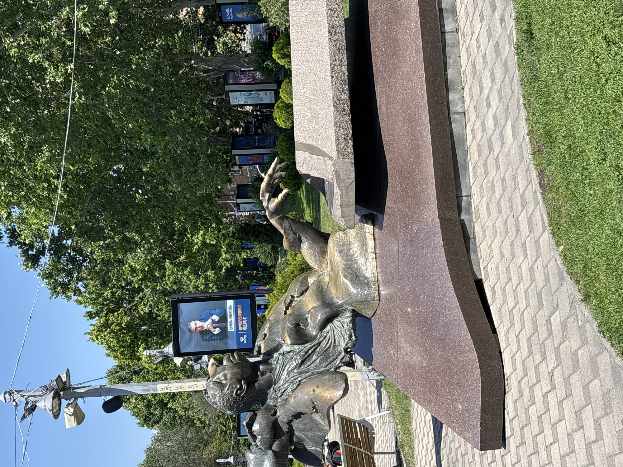 Tourist documents morning walking tour of central Yerevan landmarks