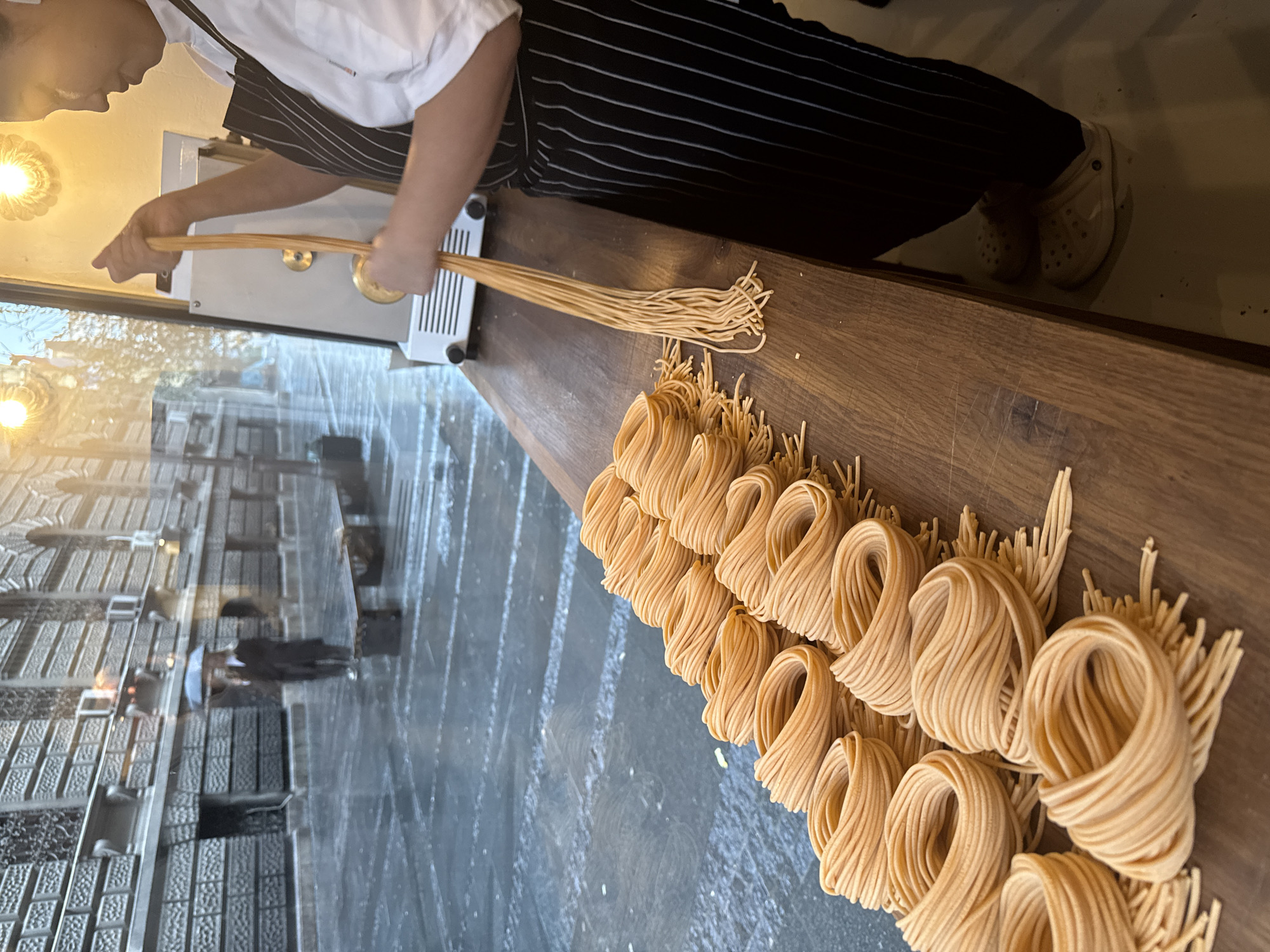 Italian restaurant pasta preparation and dining service documented