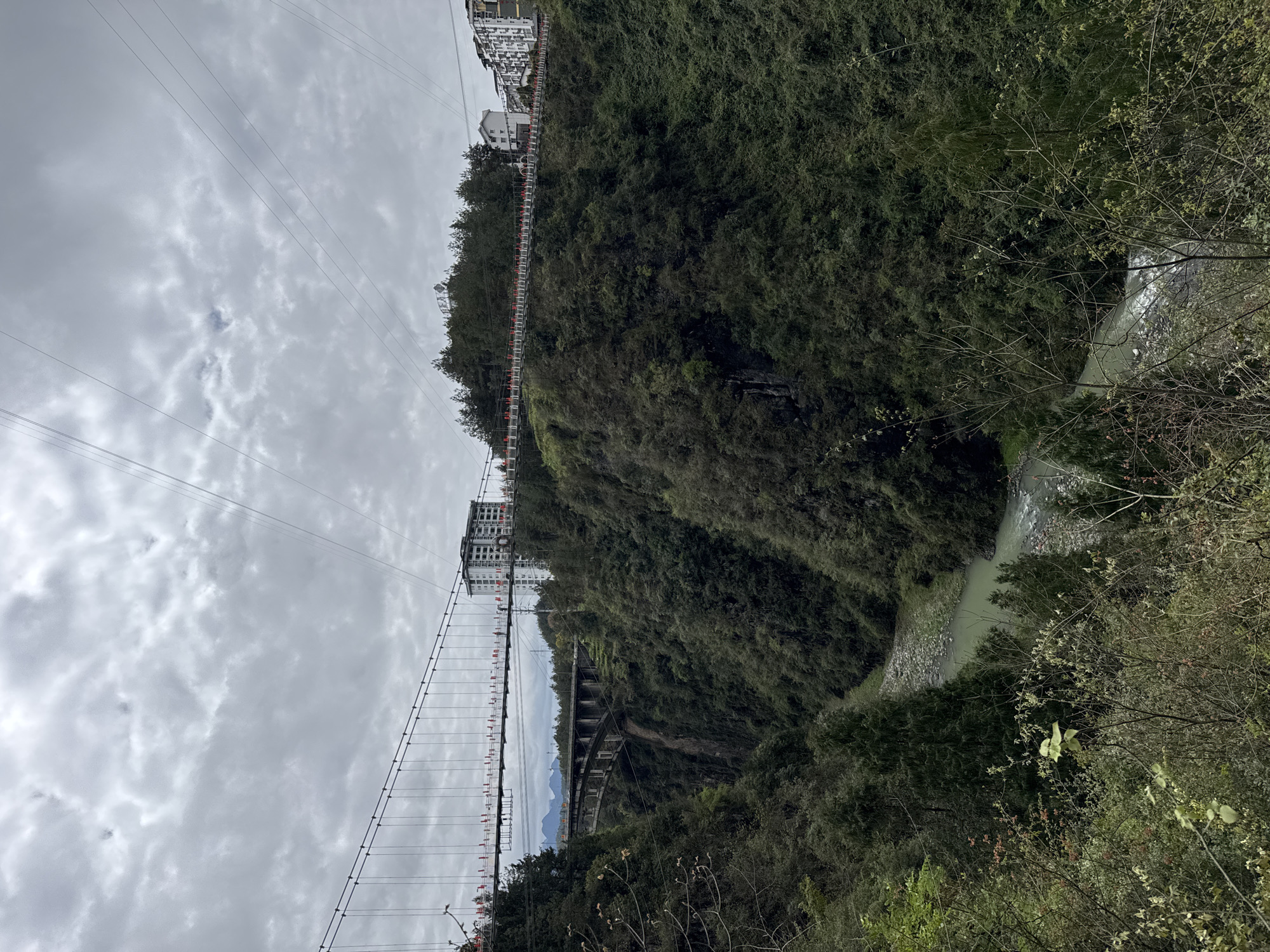 Tourist visits scenic Aizhai Bridge area in Qianjiang China