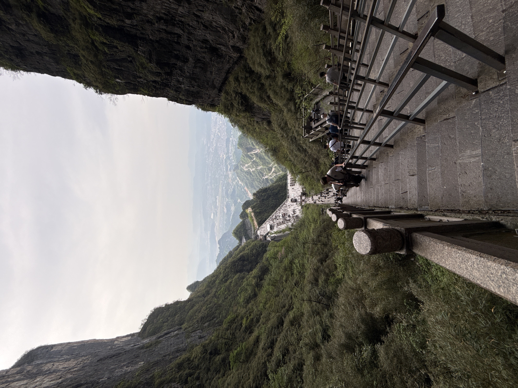 Tourist photographs famous Tianmen Mountain stairway in Zhangjiajie